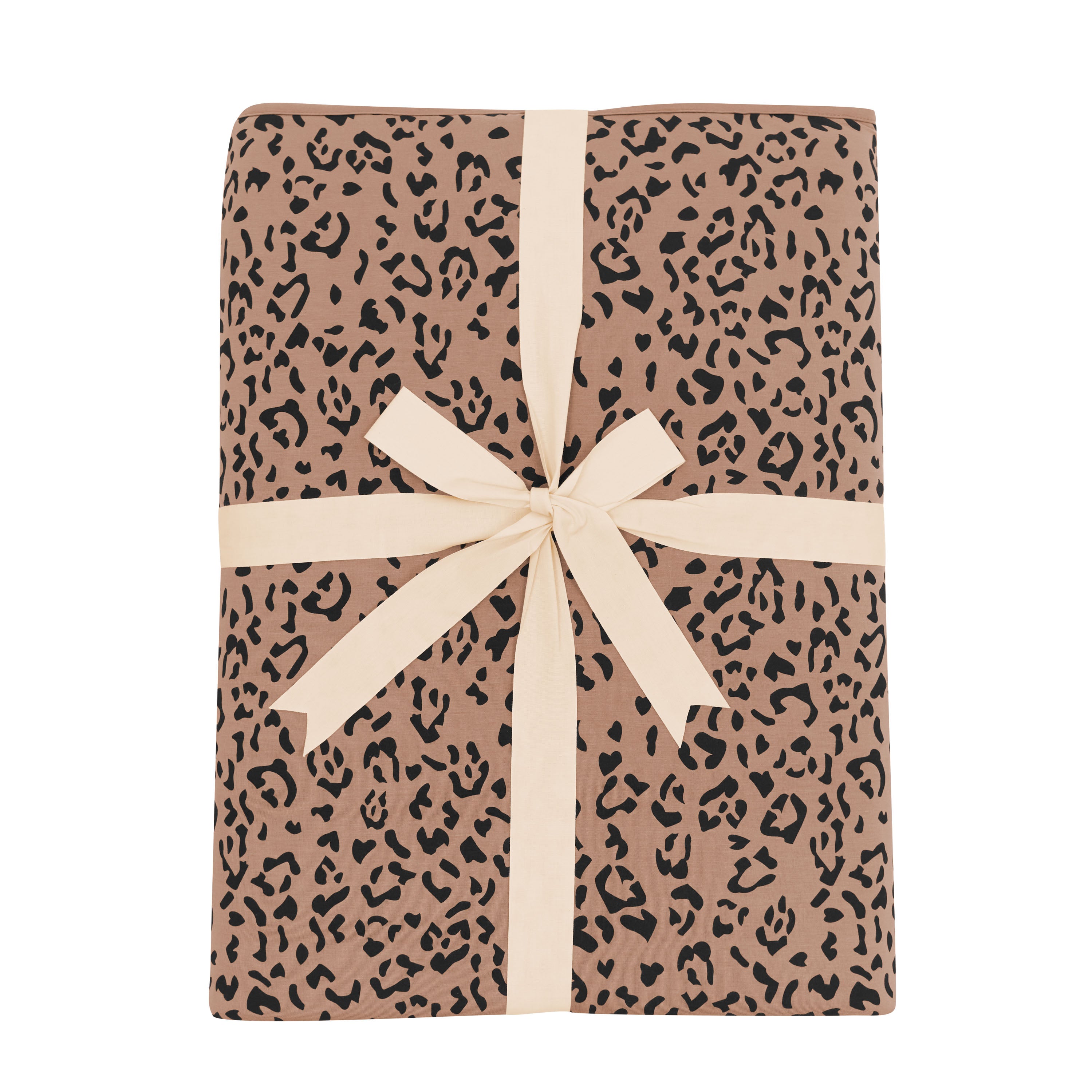 Product photo of the Youth Blanket in Latte Leopard 2.5 shown tied up in its linen ribbon