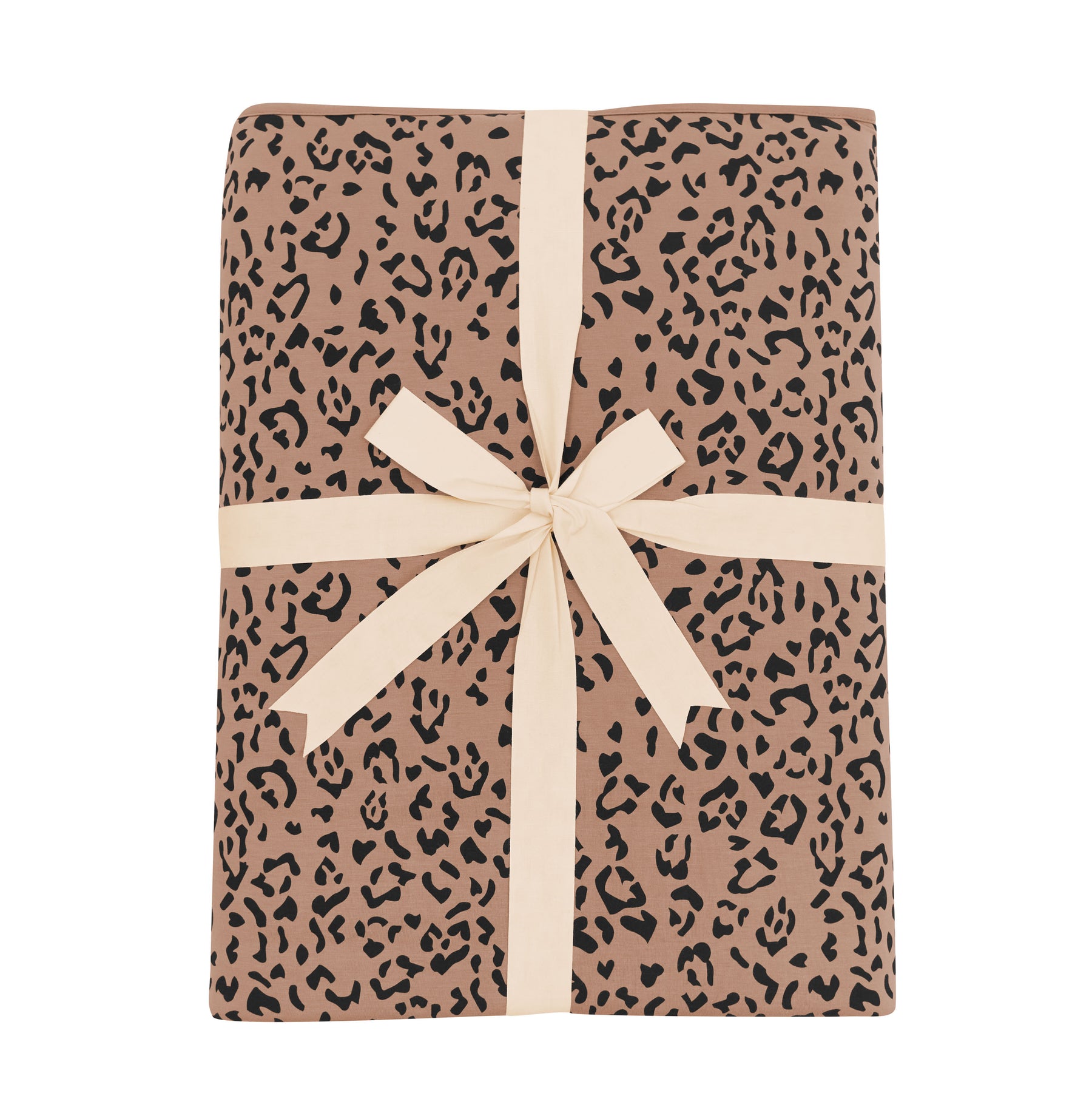 Product photo of the Youth Blanket in Latte Leopard 2.5 shown tied up in its linen ribbon
