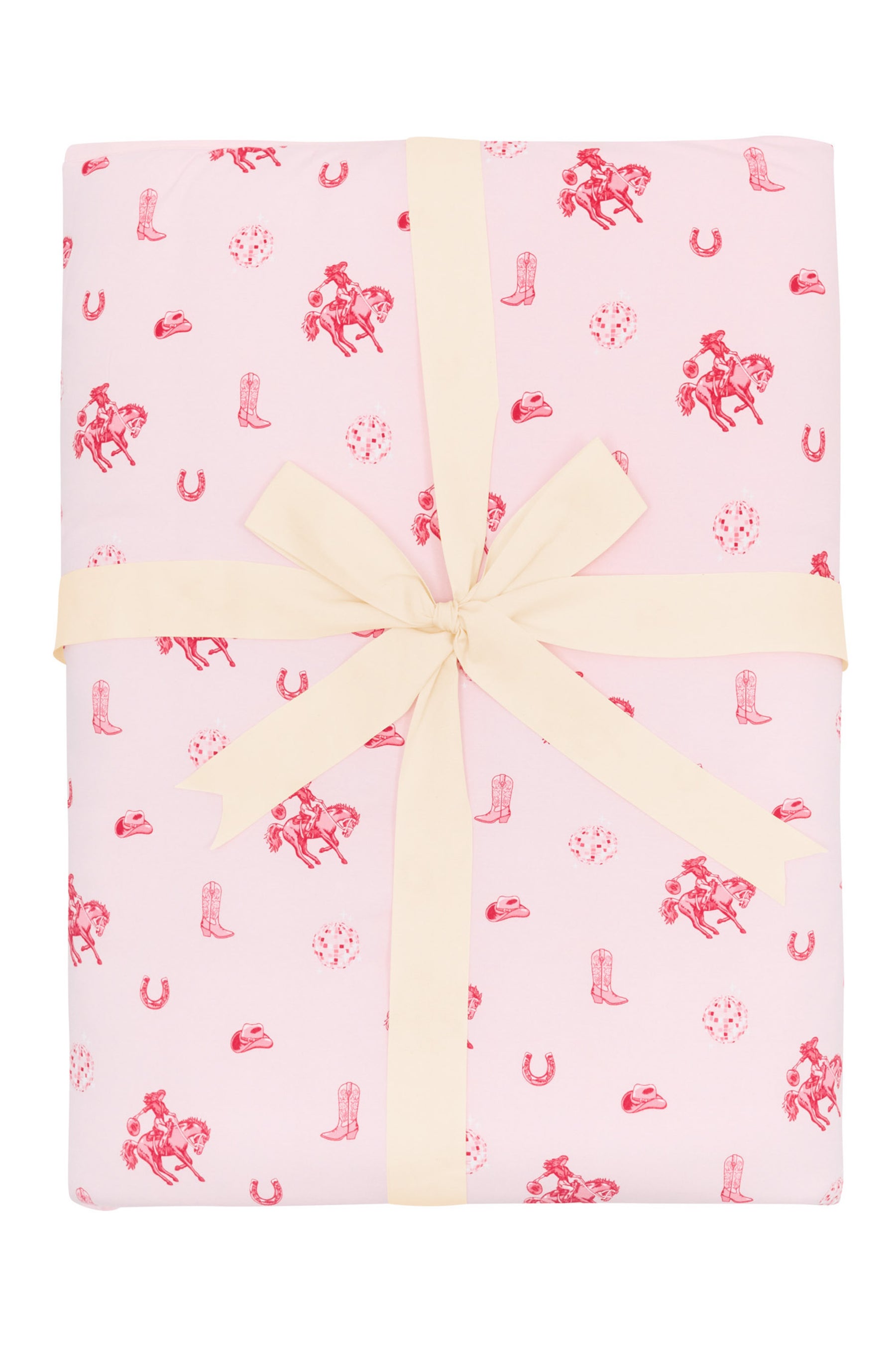 Youth Blanket in Disco Cowgirl 2.5 shown wrapped in its packaging with a linen bow