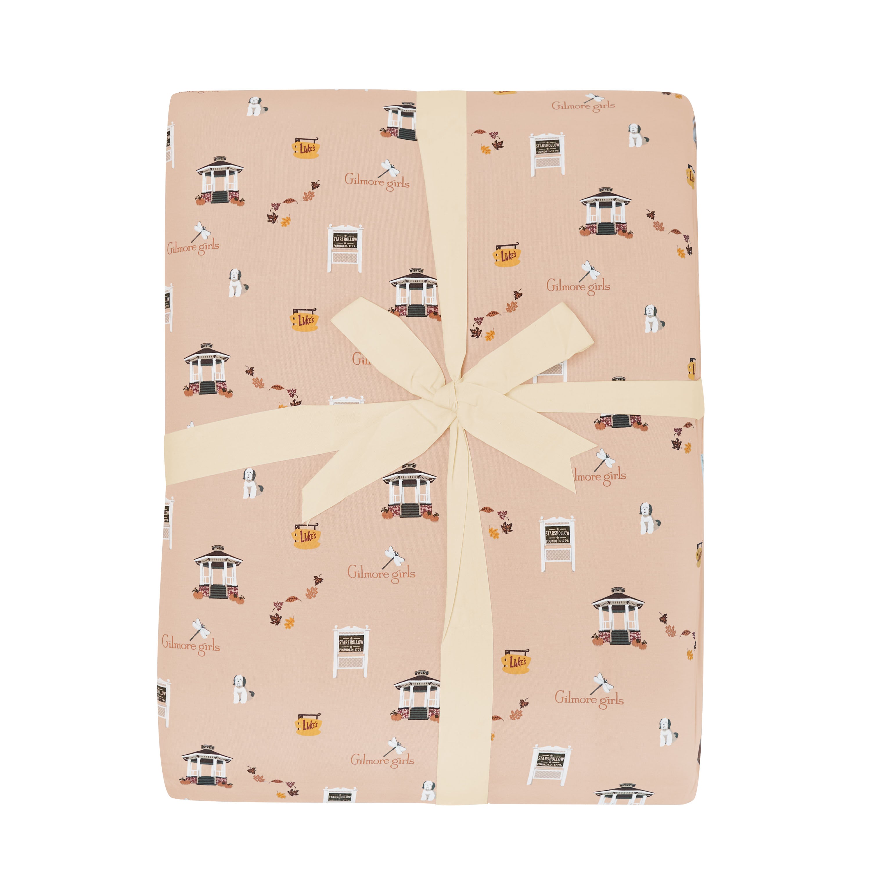 Gift wrapped throw blanket with a Gilmore Girls print on a white background