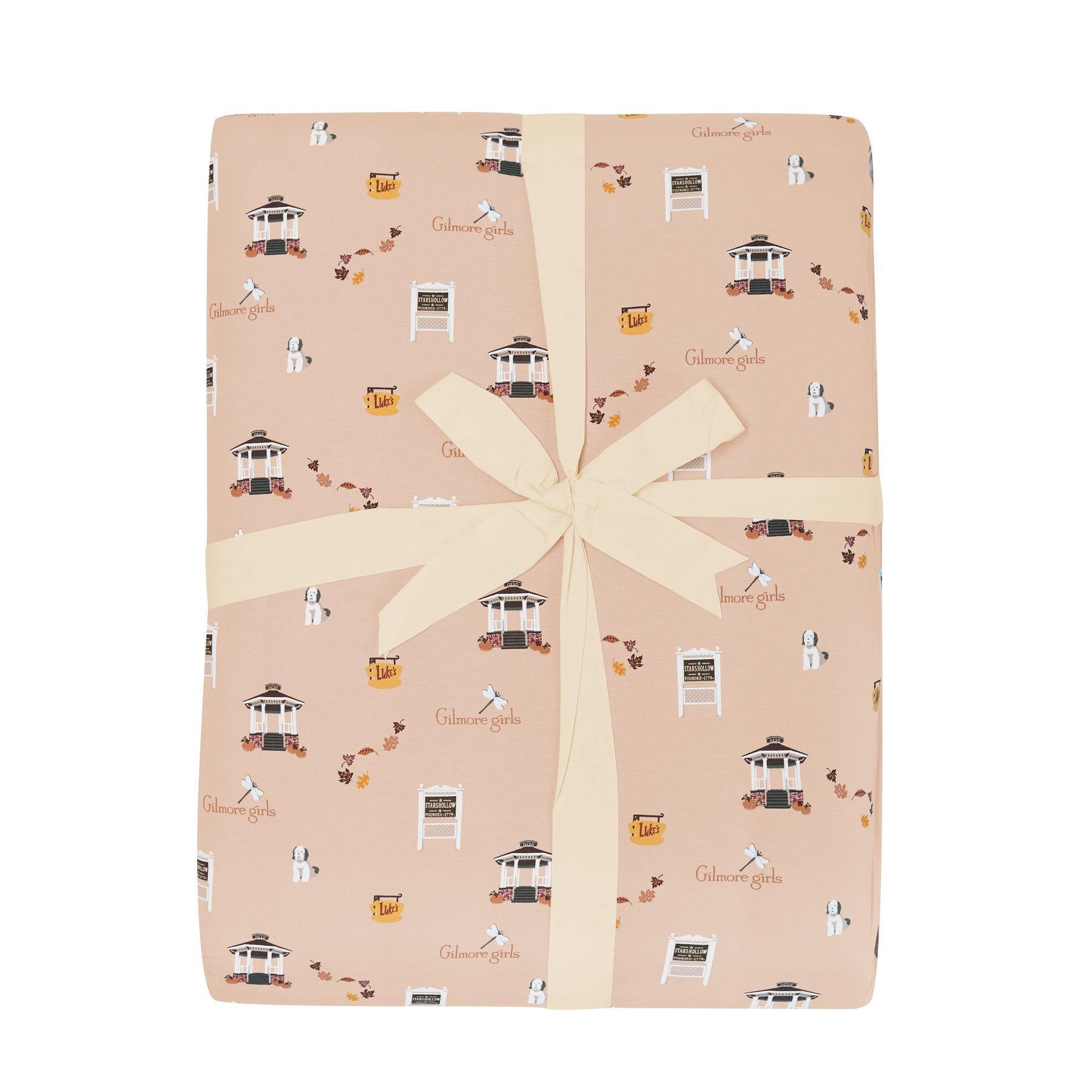 Gift wrapped throw blanket with a Gilmore Girls print on a white background