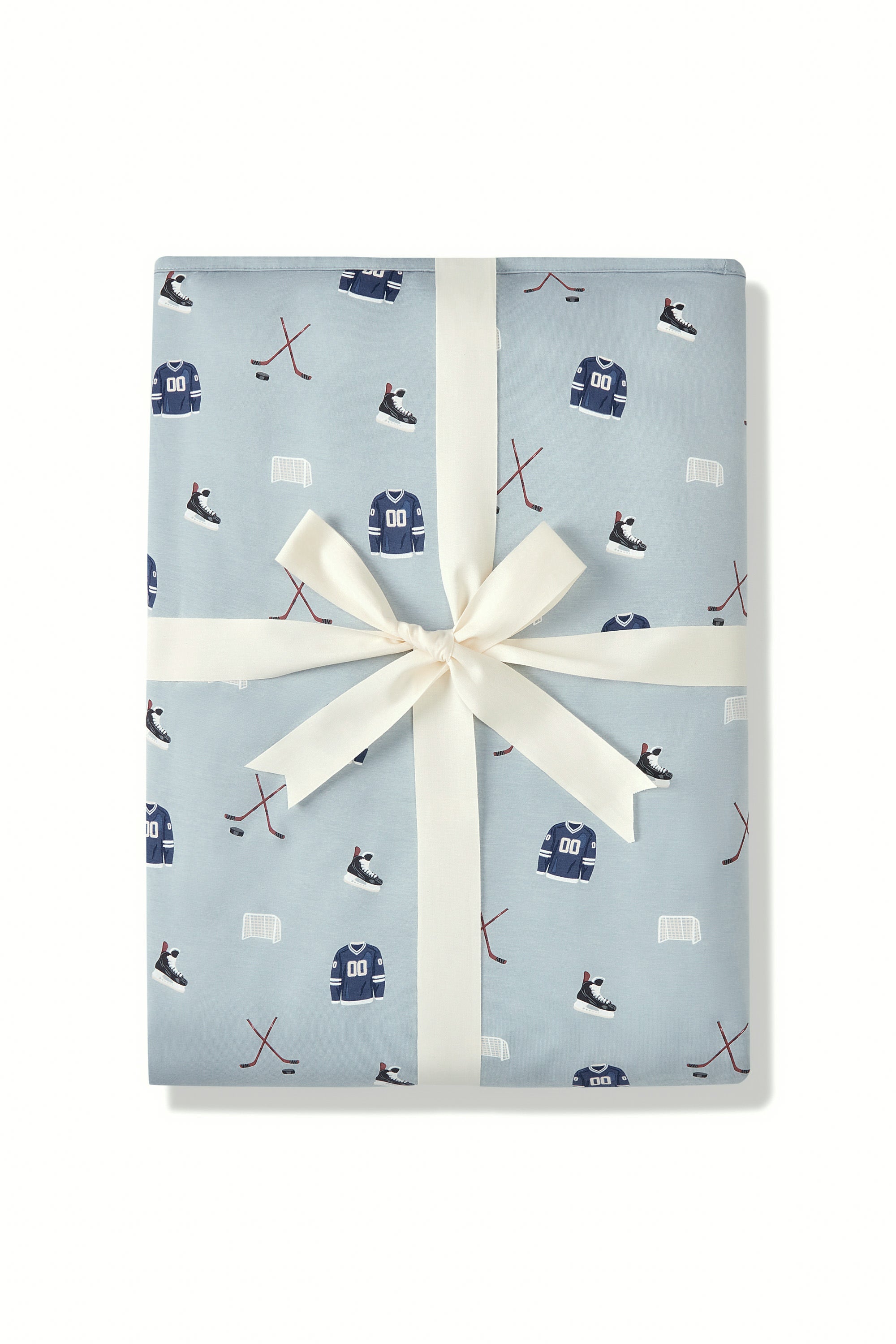 Youth Blanket in Vintage Hockey 2.5 print packed in a ribbon on a white background