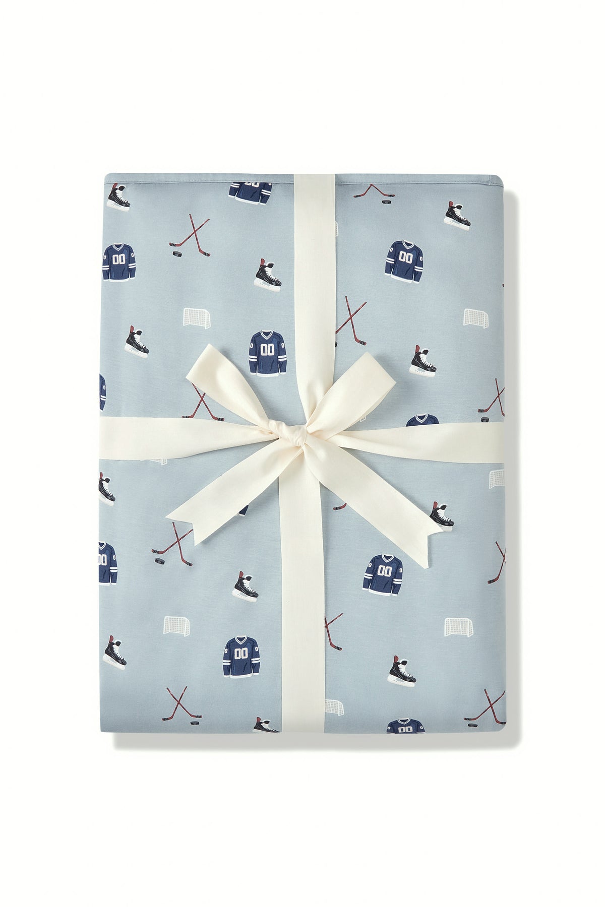 Youth Blanket in Vintage Hockey 2.5 print packed in a ribbon on a white background