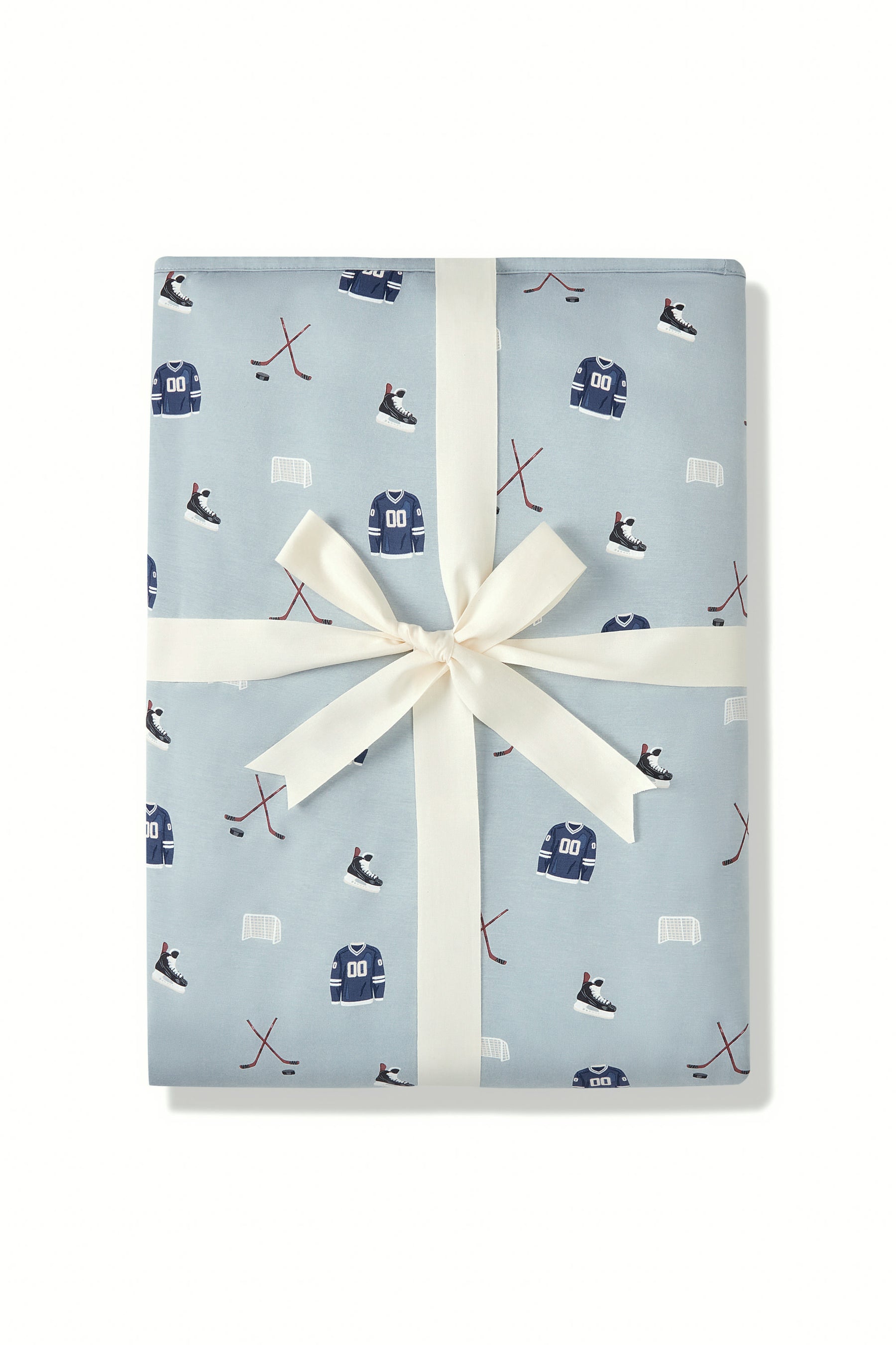 Youth Blanket in Vintage Hockey 2.5 print packed in a ribbon on a white background