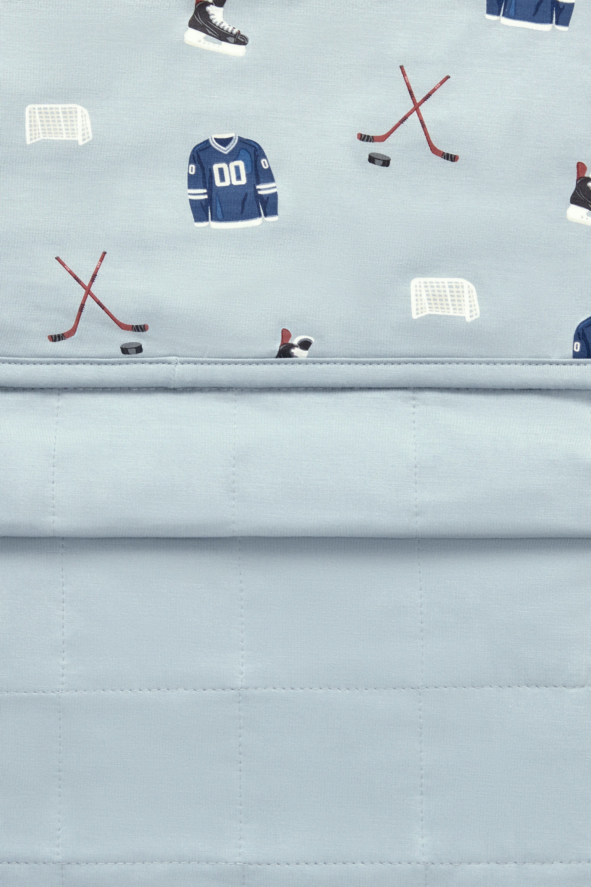 Front and back of Youth Blanket in Vintage Hockey 2.5 print