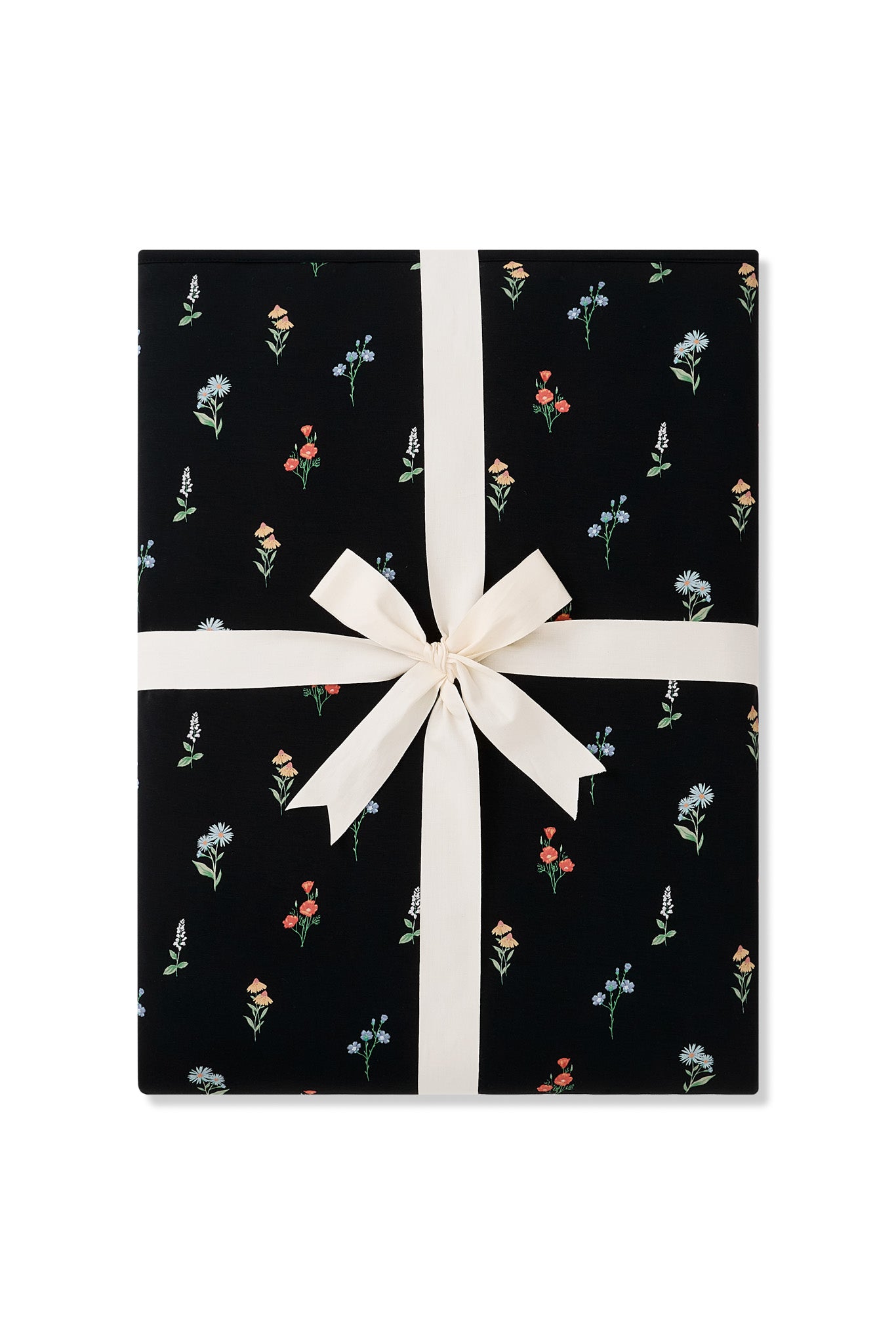 Black Youth Blanket in Wildflower 2.5 print packed with a ribbon on a white background