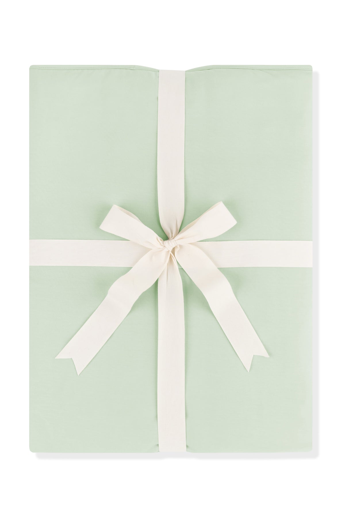 Youth Blanket in Basil 1.0 shown wrapped in its packaging tied with a linen bow