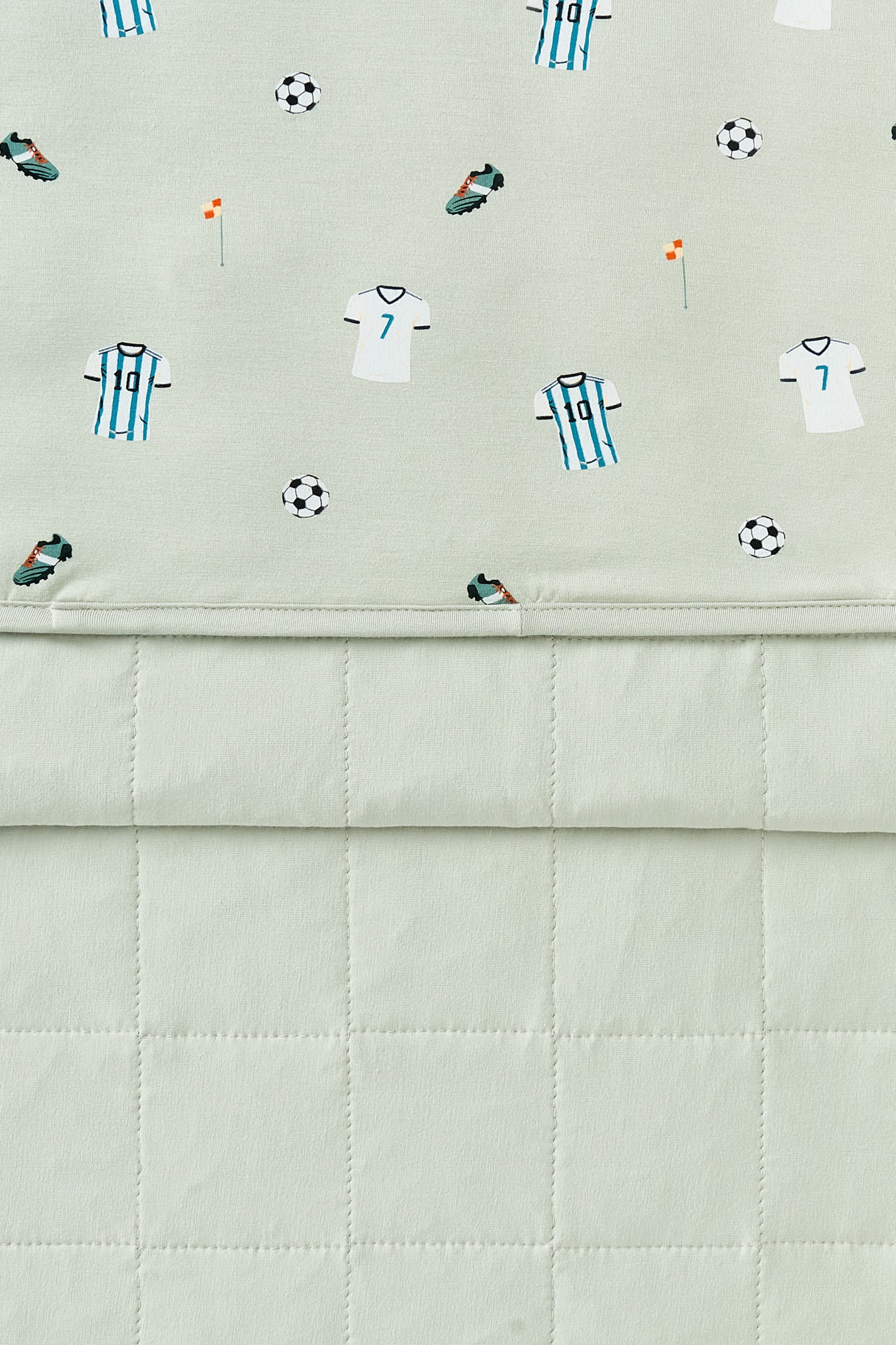 Front and back side of Youth Blanket in Soccer print