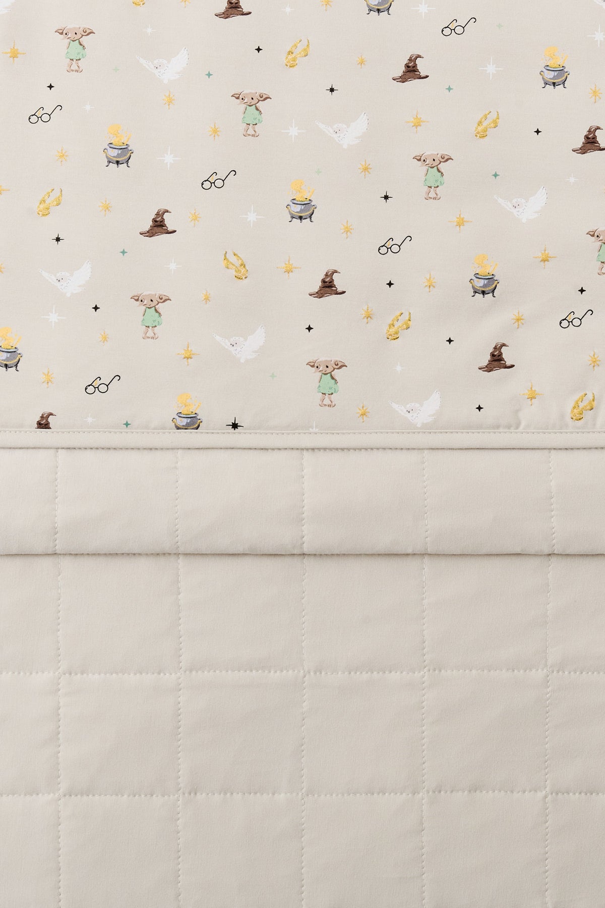 Beige Youth Blanket with Harry Potter pattern print with plain beige fabric at the back