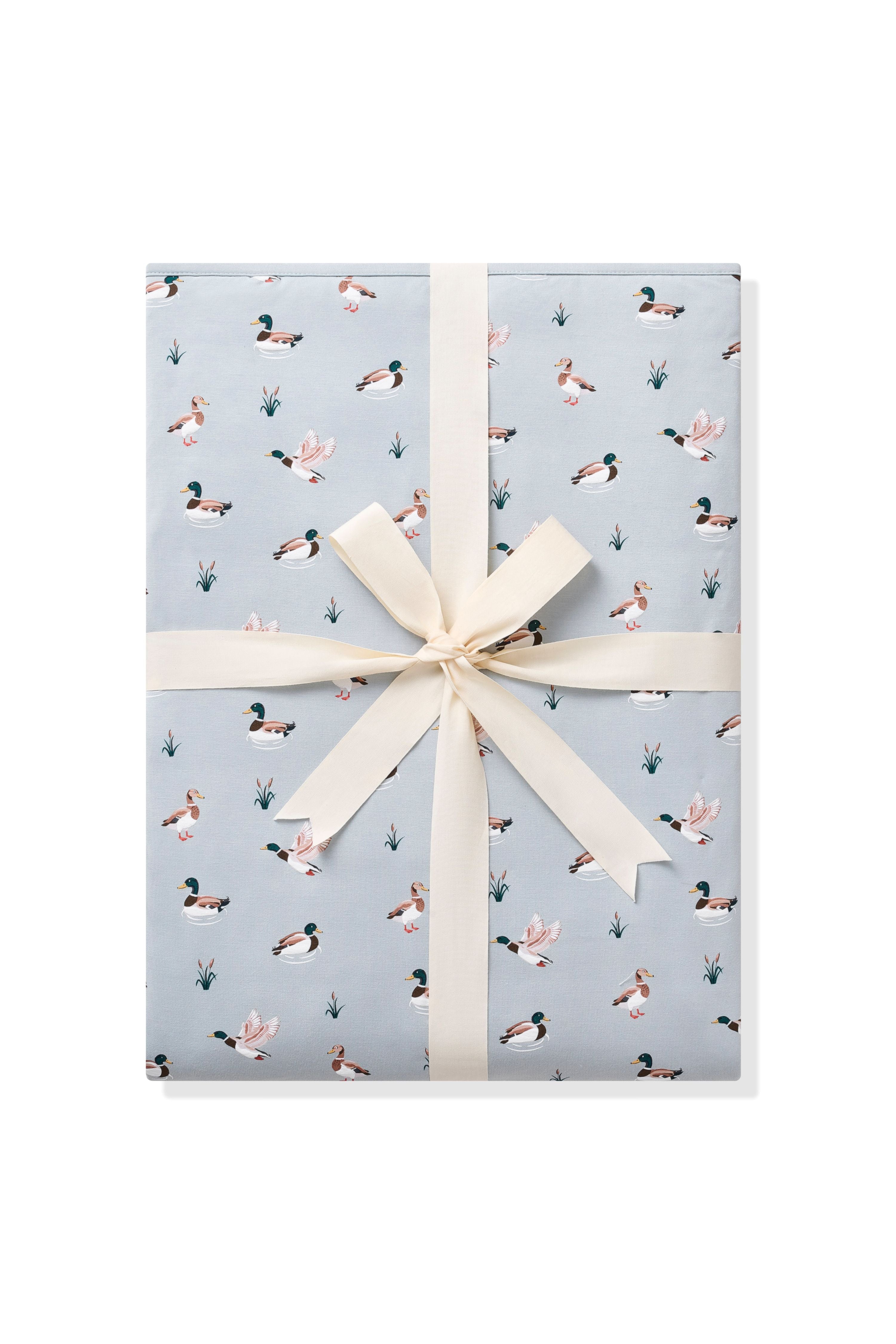 Youth Blanket in Mallard Duck 1.0 shown in its packaging shown tied in a linen bow