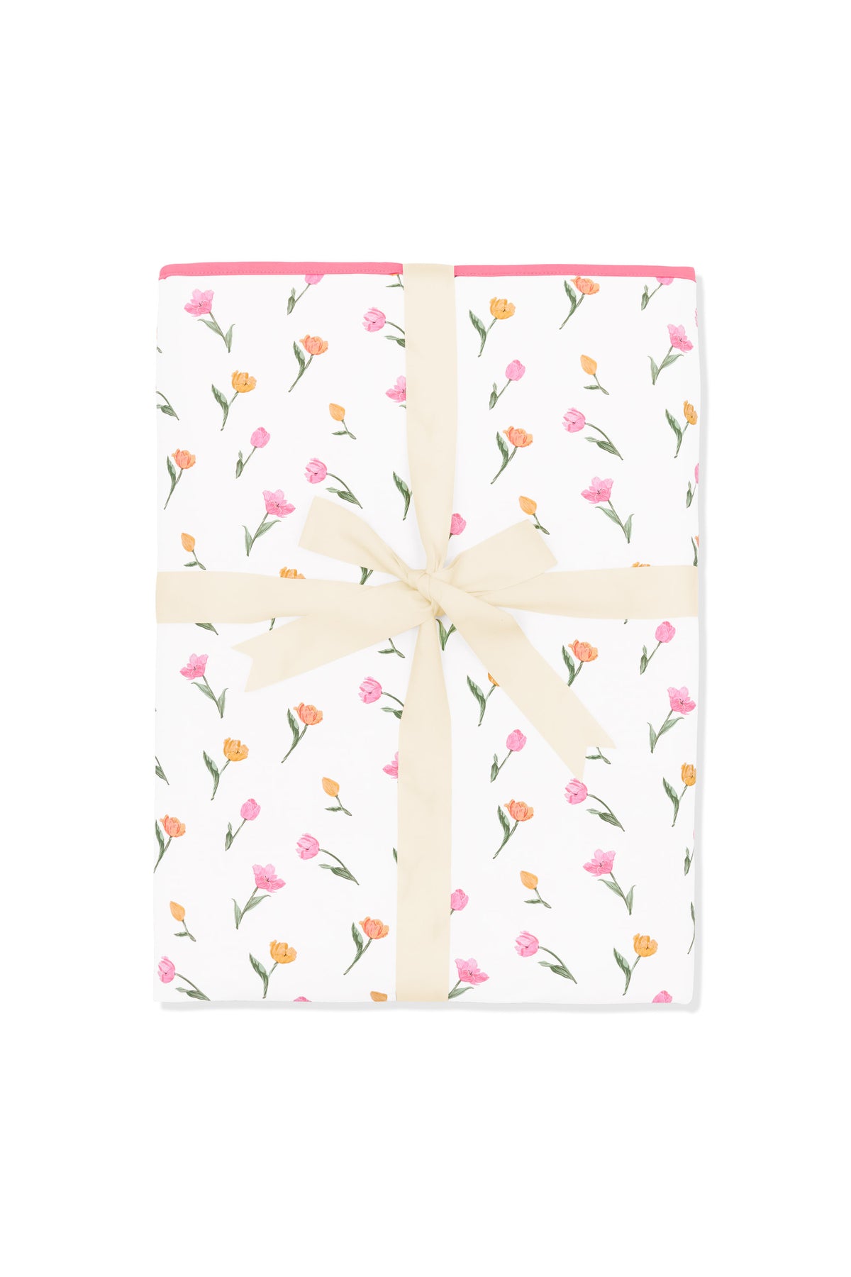Youth Blanket in Tulip 1.0 shown in its packaging tied with a linen bow