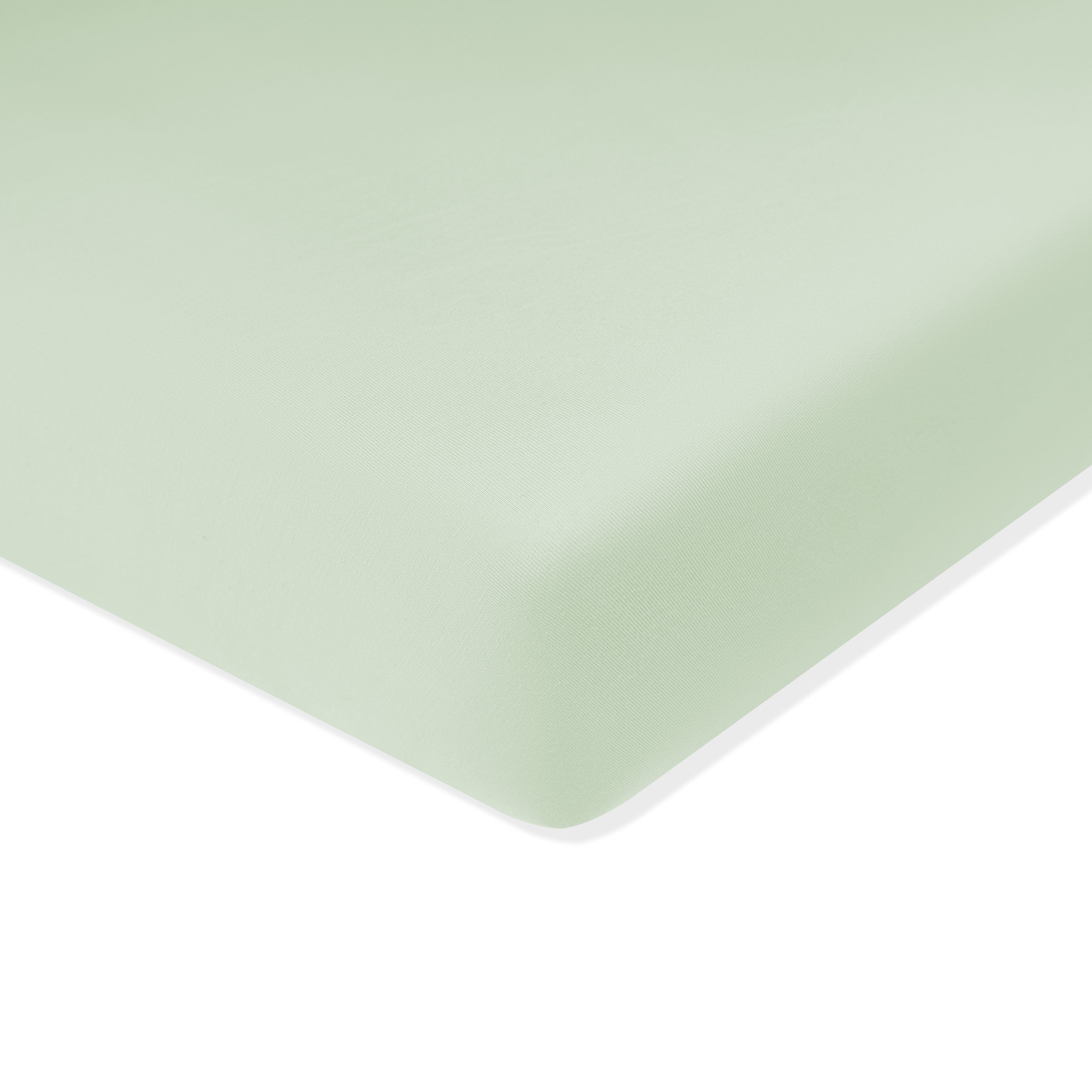 Mini Crib Sheet in Basil shown on a crib mattress