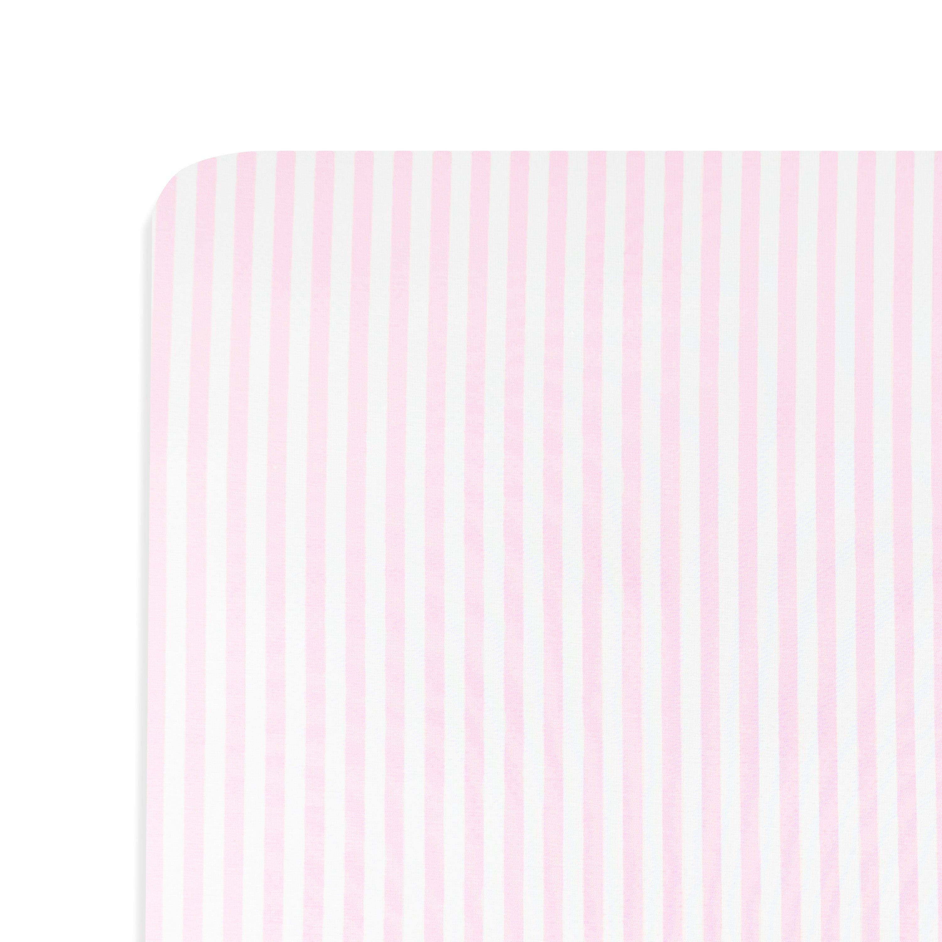 Close up of the Mini Crib Sheet in Small Sakura Stripe on a mattress
