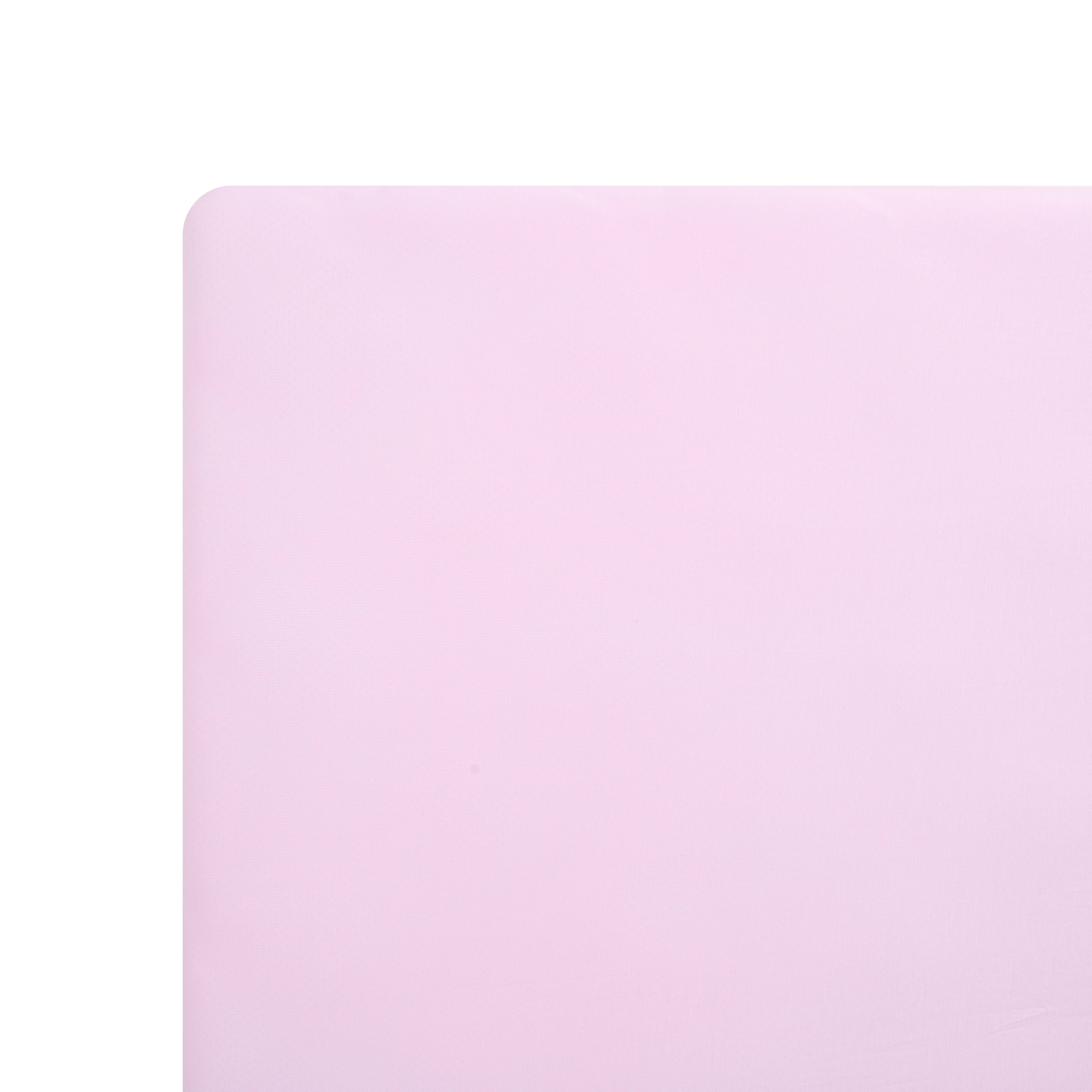 Solid light purple mini crib sheet on mattress