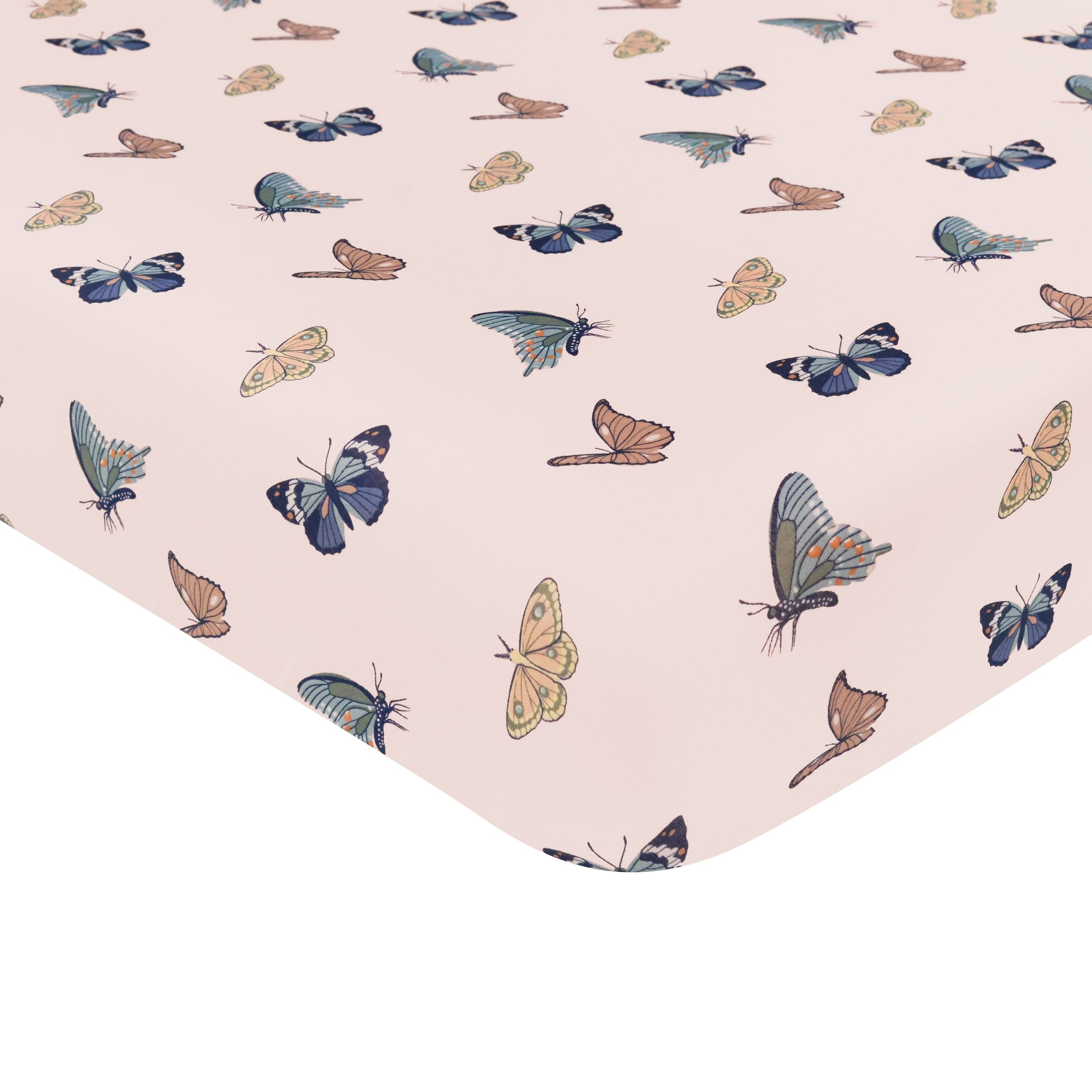 Crib sheet in Blush Butterfly showing corner of crib mattress