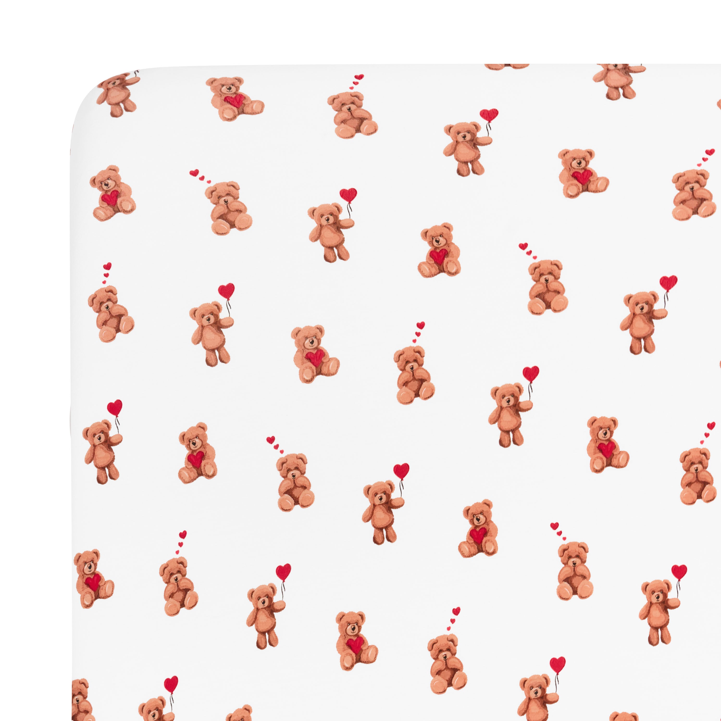 Close up of the corner of the Crib Sheet in Bear Hearts shown on the crib mattress