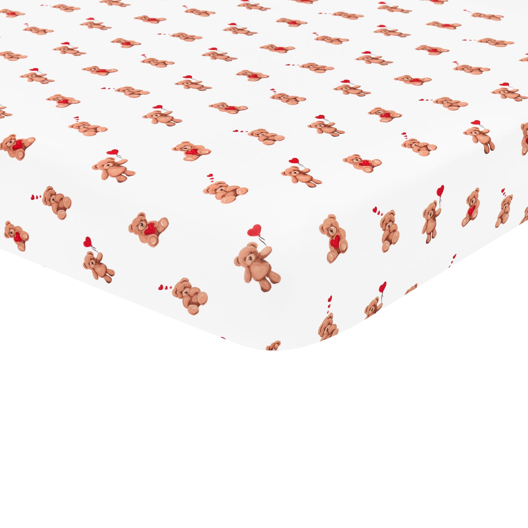 The soft and breathable Crib Sheet in Bear Hearts shown on a crib mattress