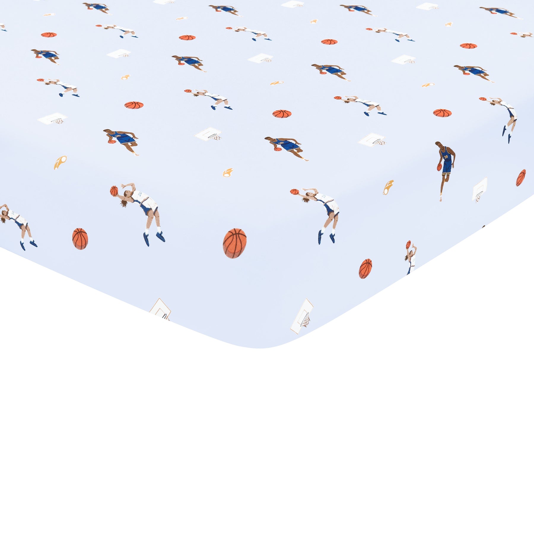 Corner of the Crib Sheet in Basketball shown on a crib mattress