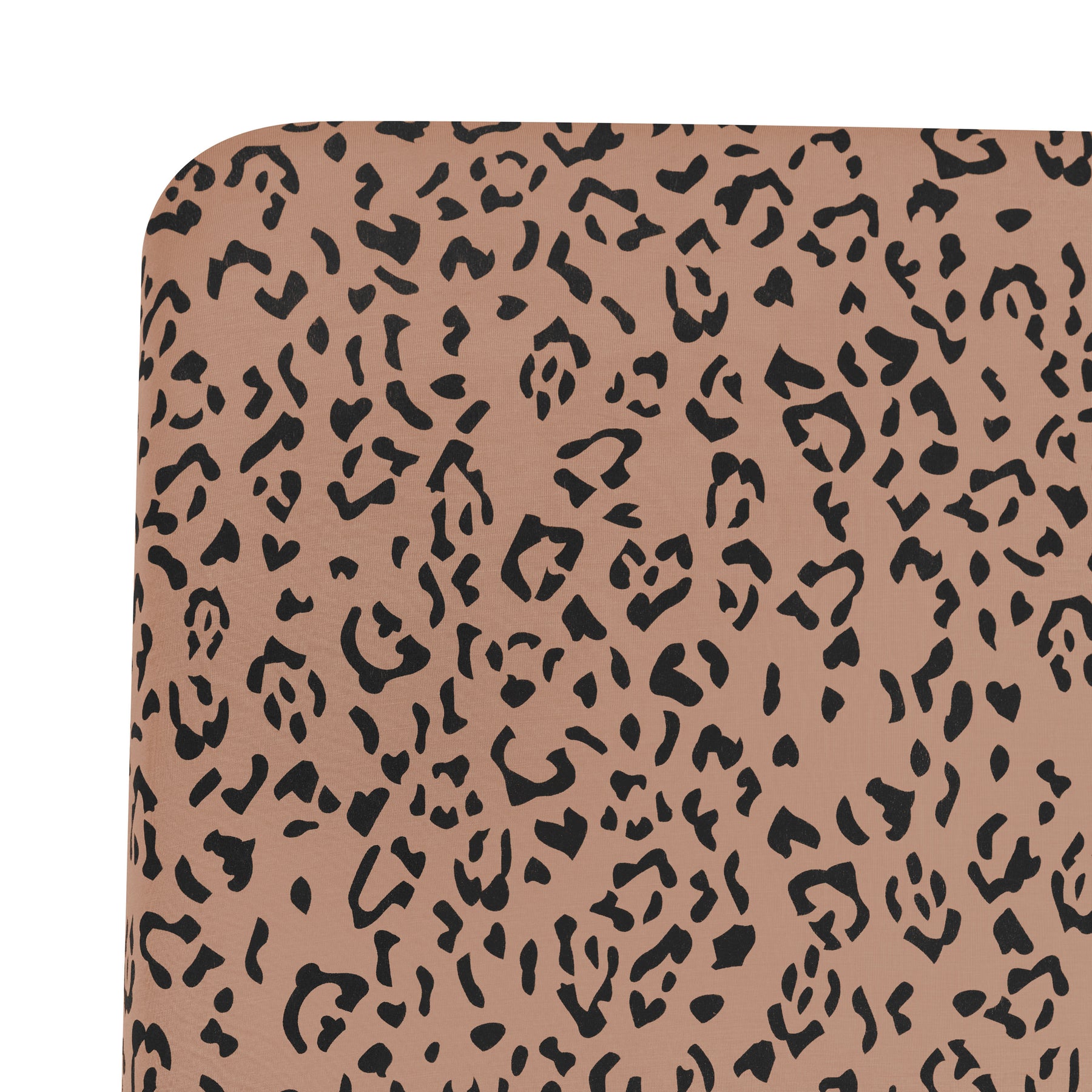 Close up of corner of the Crib Sheet in Latte Leopard shown on a mattress