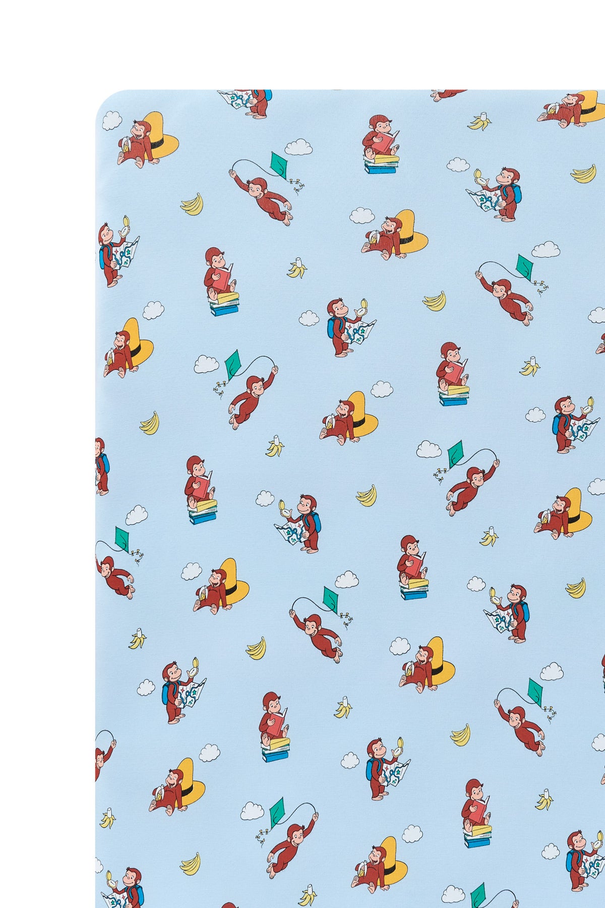 Close up of Blue Crib Sheet in Curious George print on a white background