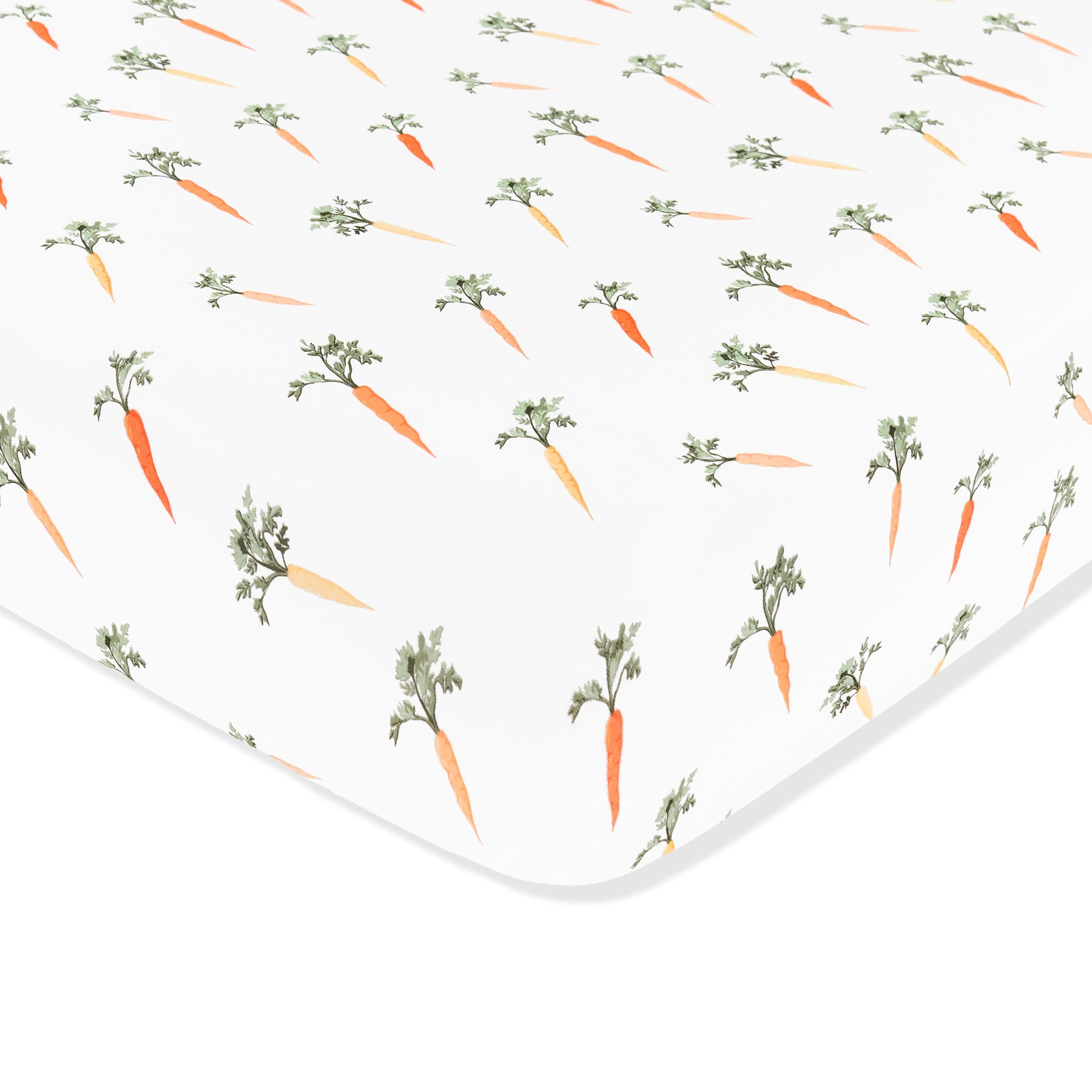 Corner of the Crib Sheet in Carrot shown on a crib mattress