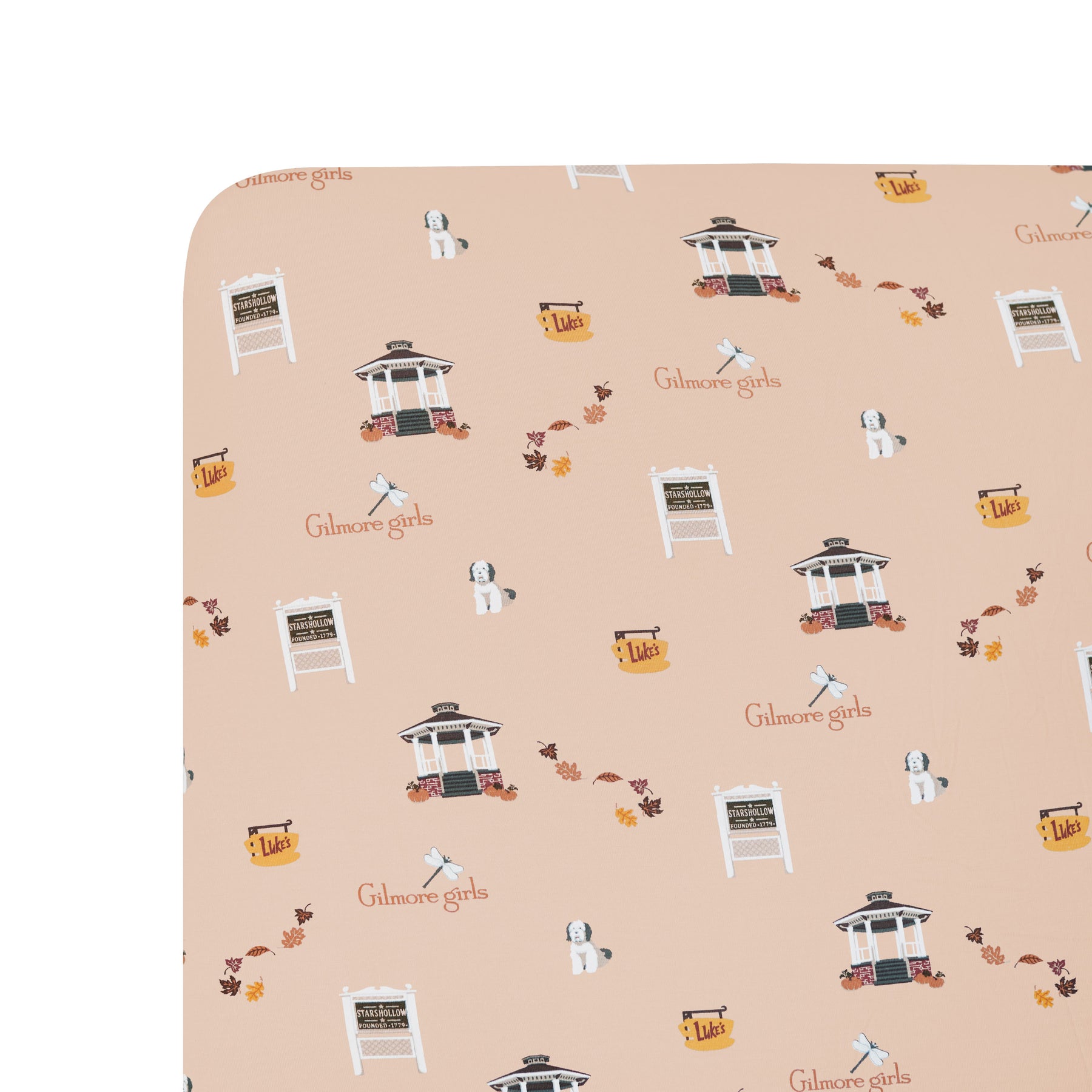 Patterned fabric with 'Gilmore Girls' branding on a beige background
