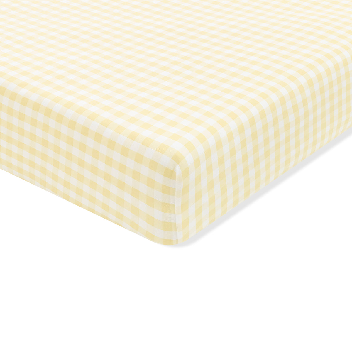 Corner of the Crib Sheet in Gingham Chamomile shown on a mattress