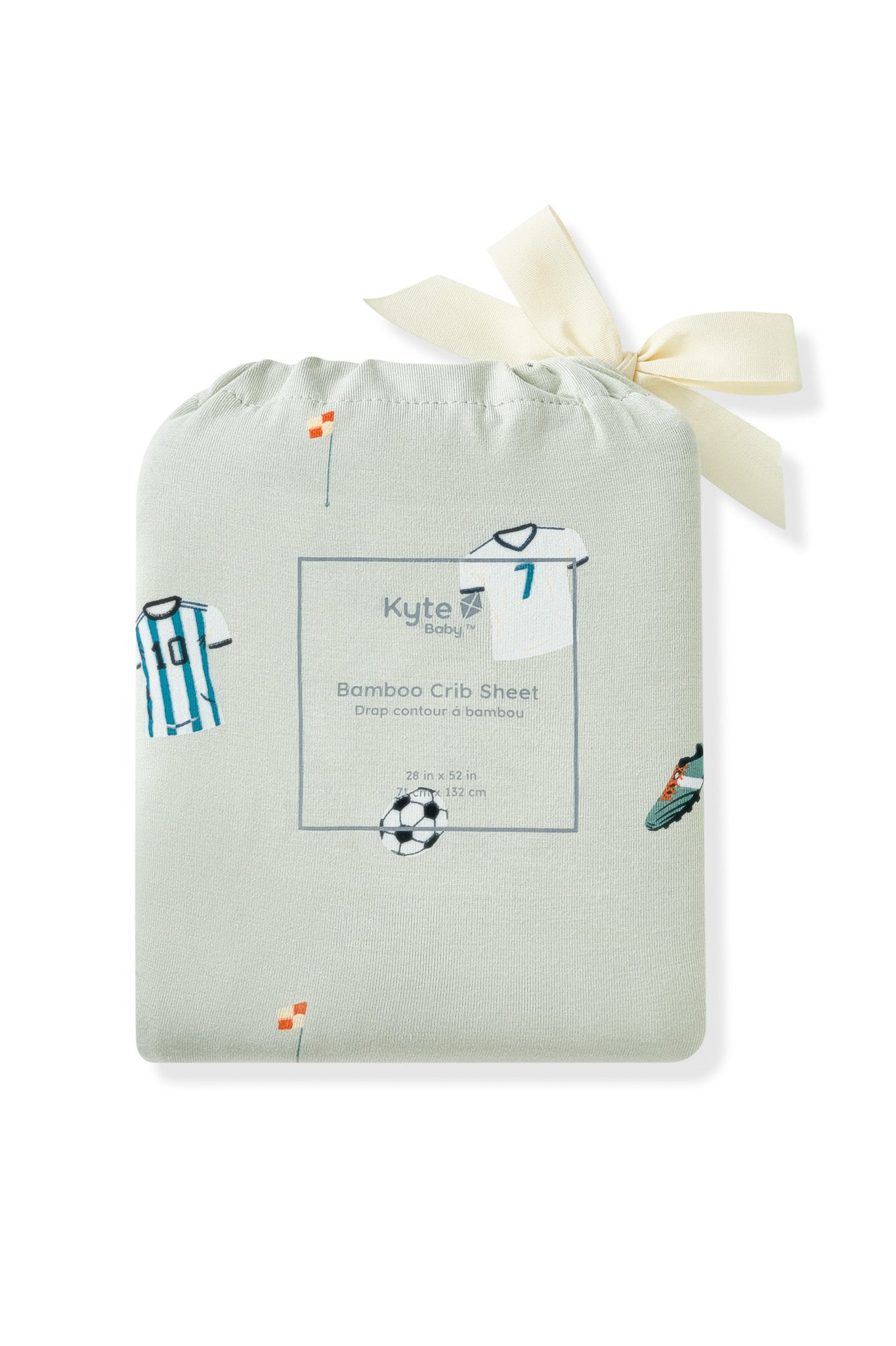 Crib sheet packed in a soccer print bag on white background