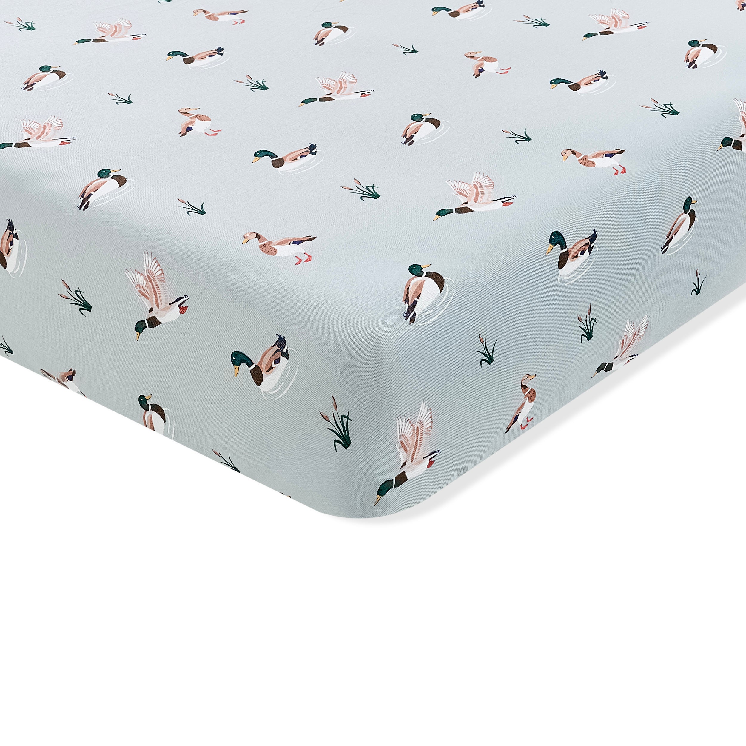 Corner of the Crib Sheet in Mallard Duck shown on a crib mattress