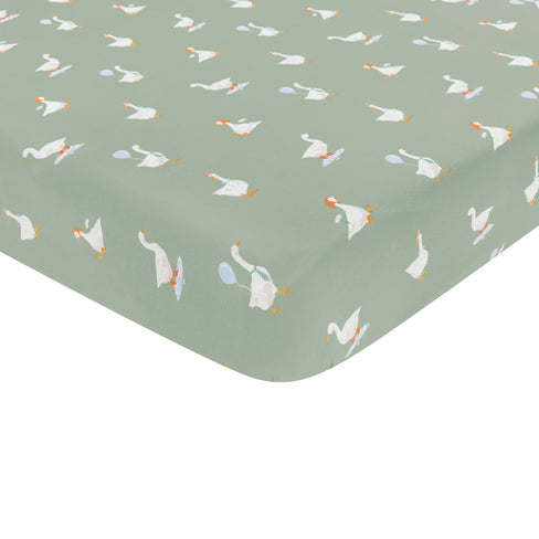 Corner of the Crib Sheet in Silly Goose shown on a crib mattress