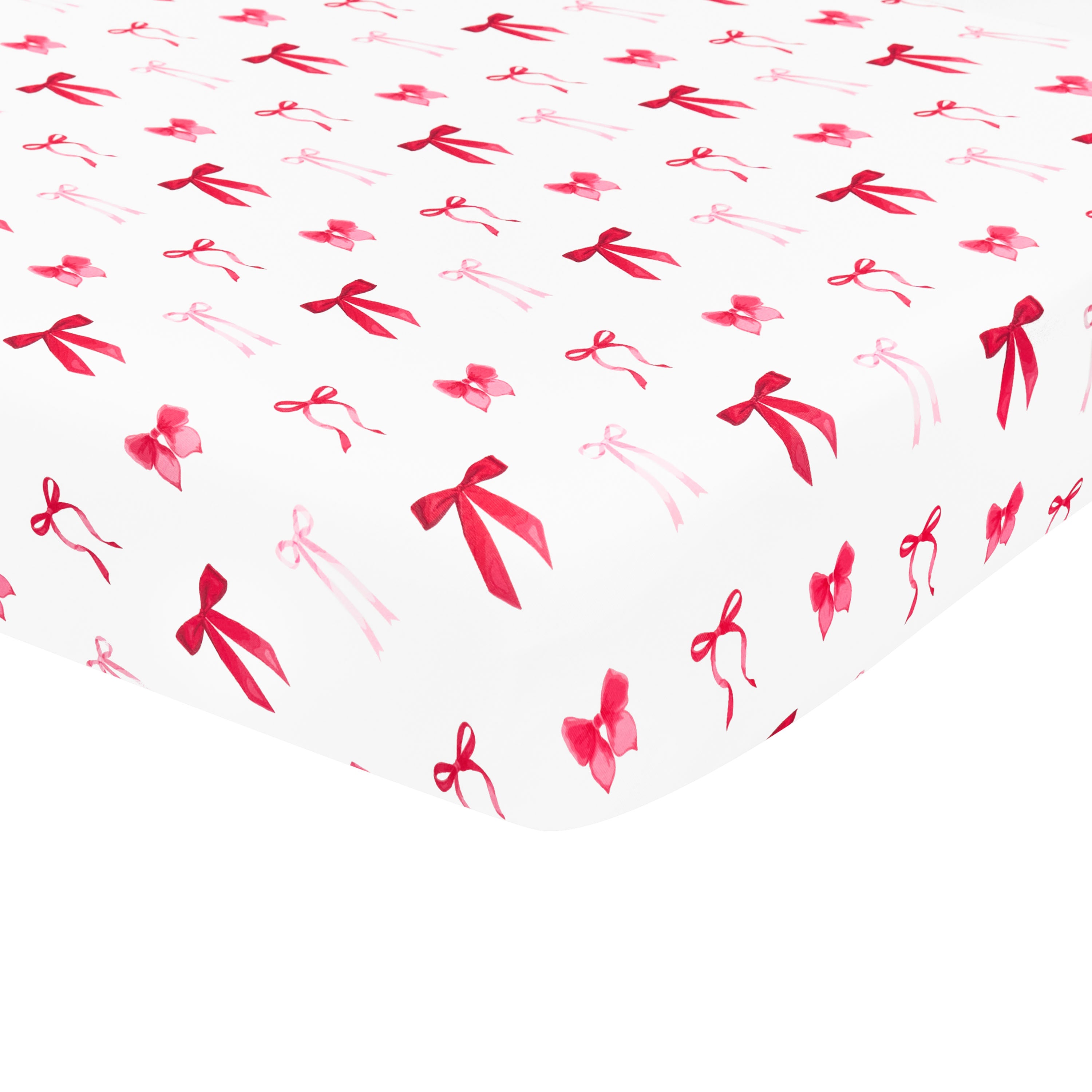 The soft and breathable Crib Sheet in Small Love Bow shown on a crib mattress