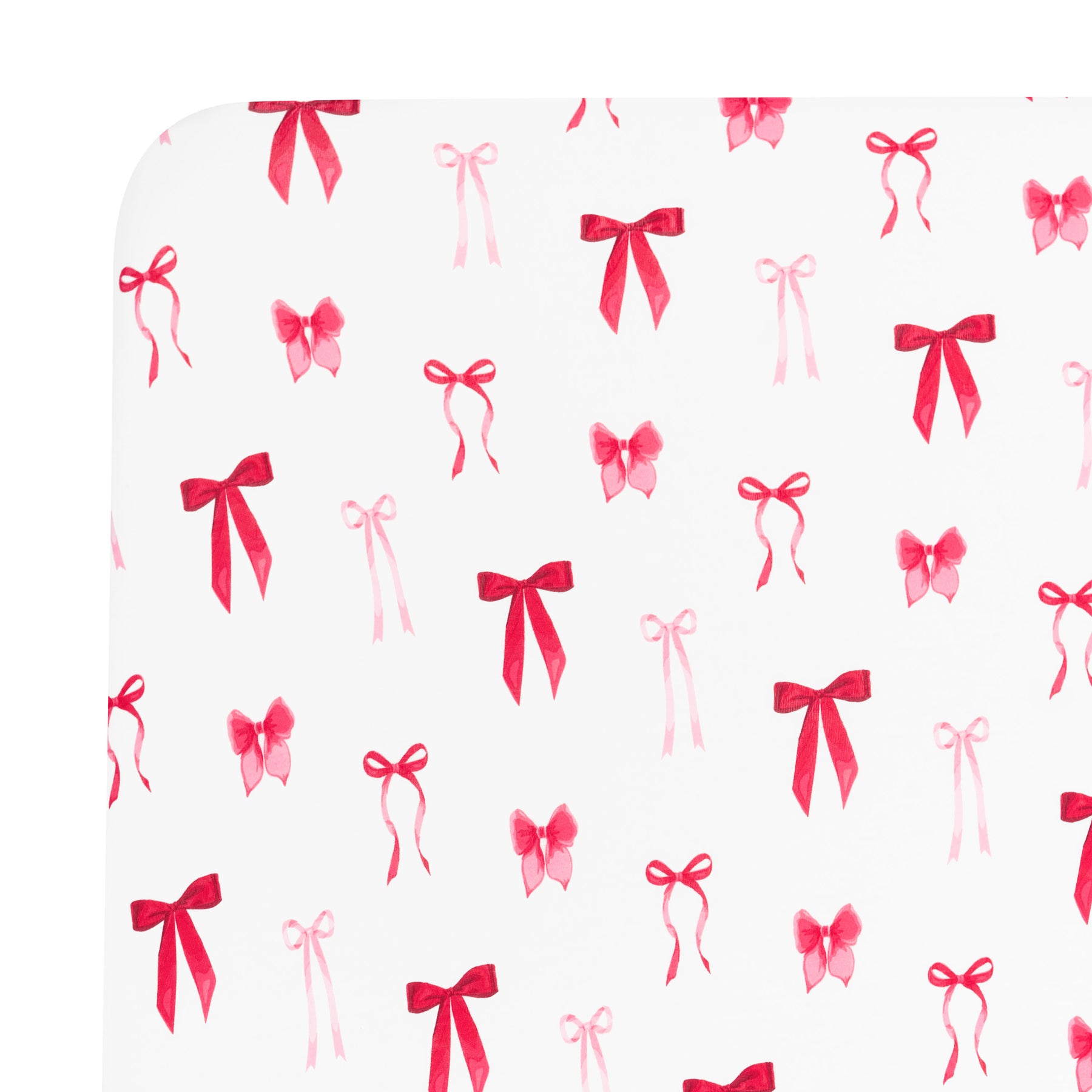 Corner of the Crib Sheet in Small Love Bow shown on a crib mattress