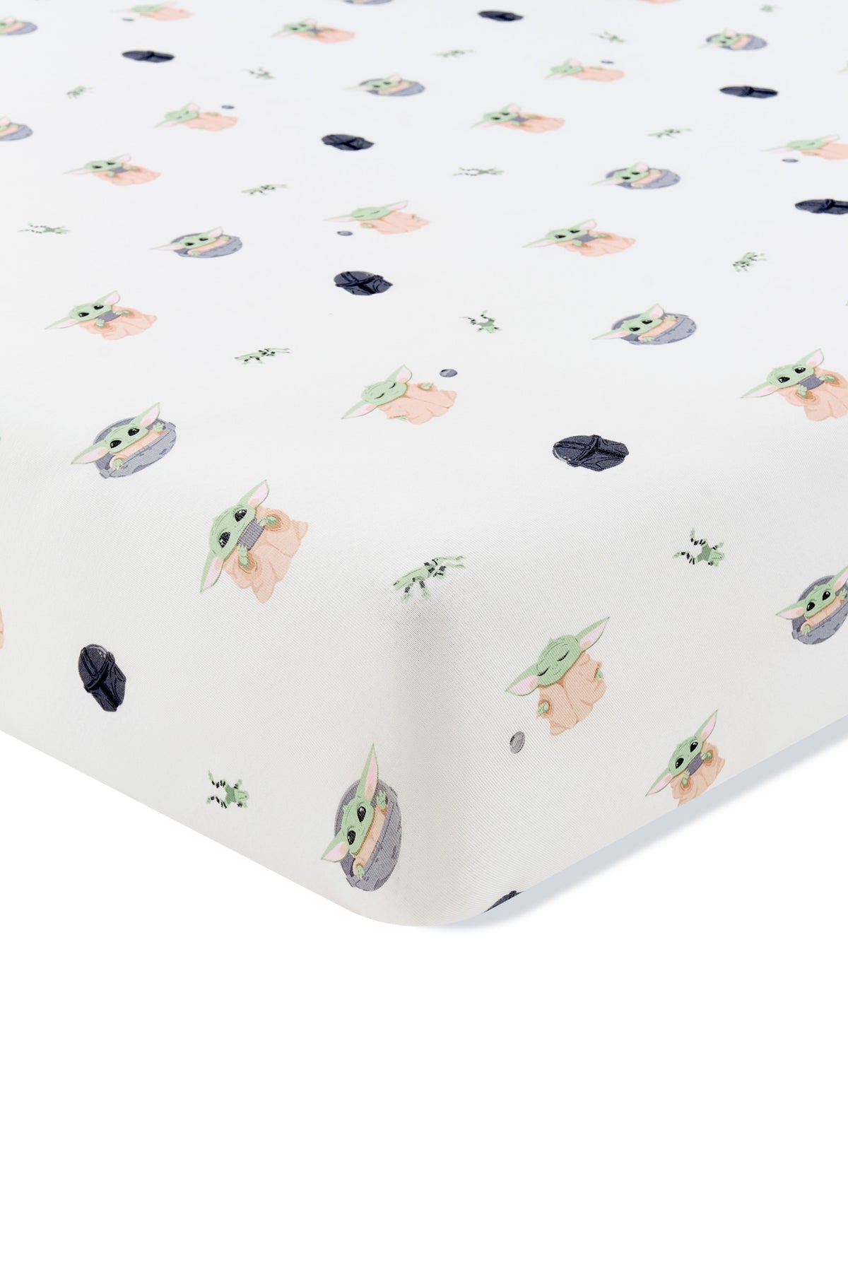 Corner of the Crib Sheet in Grogu™ shown on a crib mattress