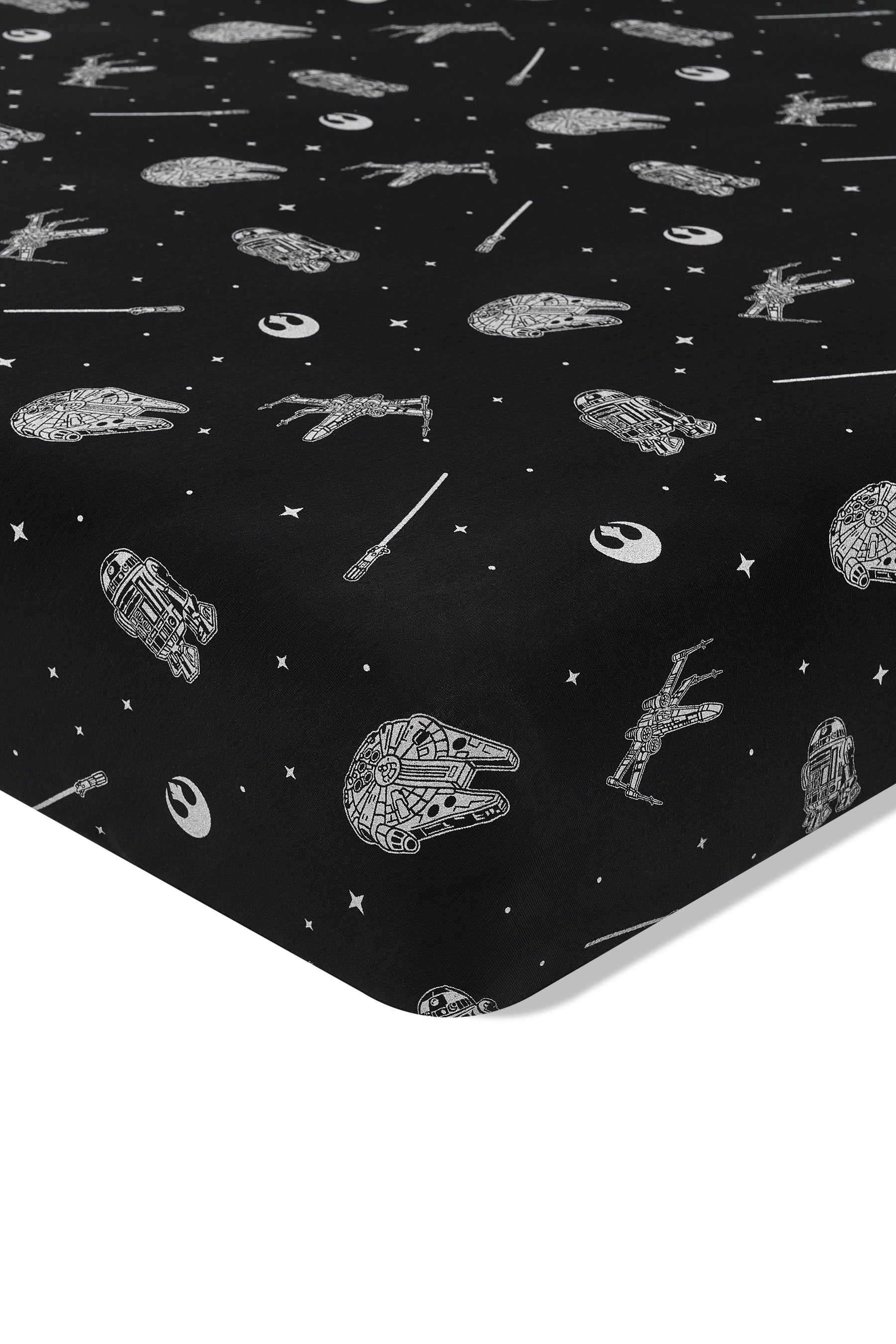 Close up of the corner of the Crib Sheet in STAR WARS™ on a crib mattress