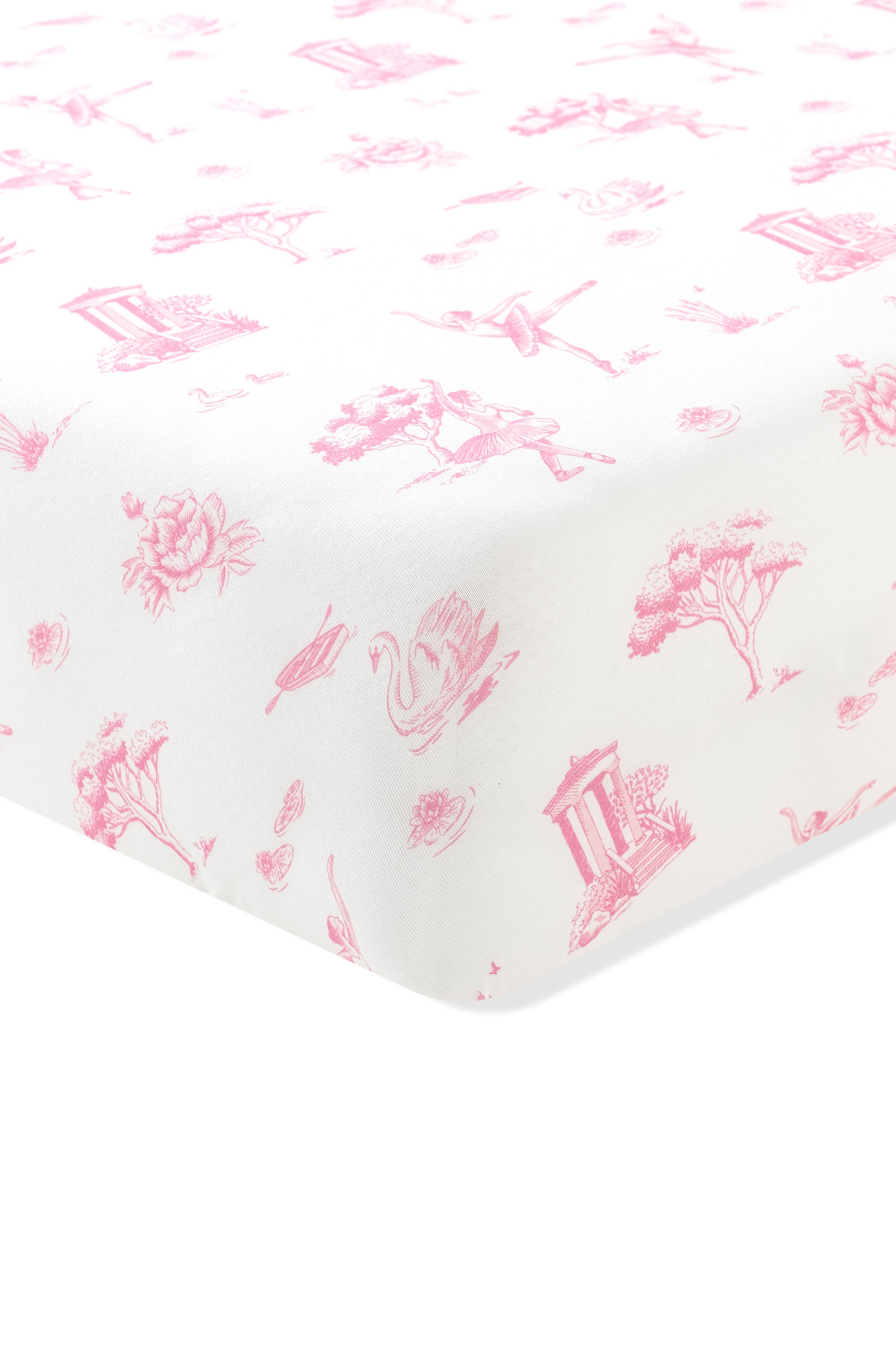 The corner of the Crib Sheet in Toile Ballet on a mattress