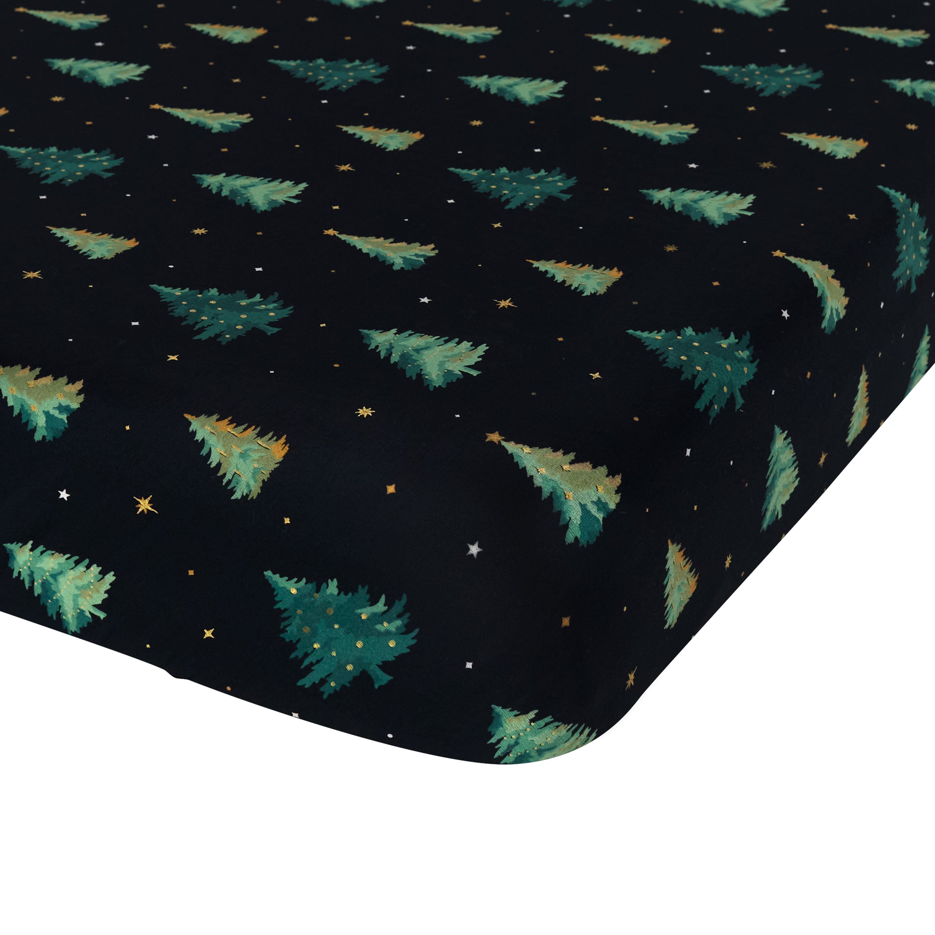 Corner of the Crib Sheet in Twinkle Tree shown on a crib mattress