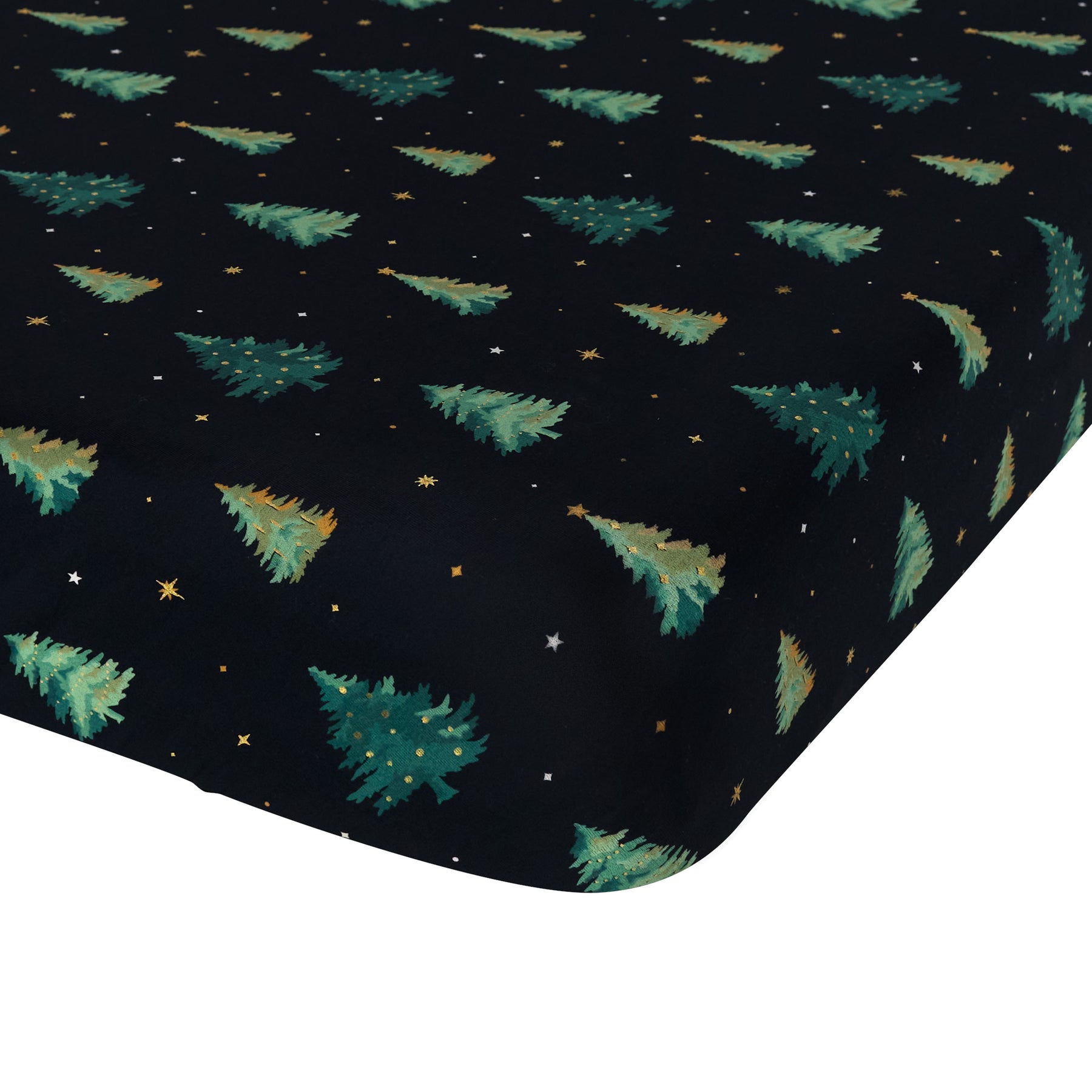 Corner of the Crib Sheet in Twinkle Tree shown on a crib mattress