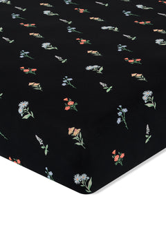 Black Crib Sheet in Wildflower print on a white background
