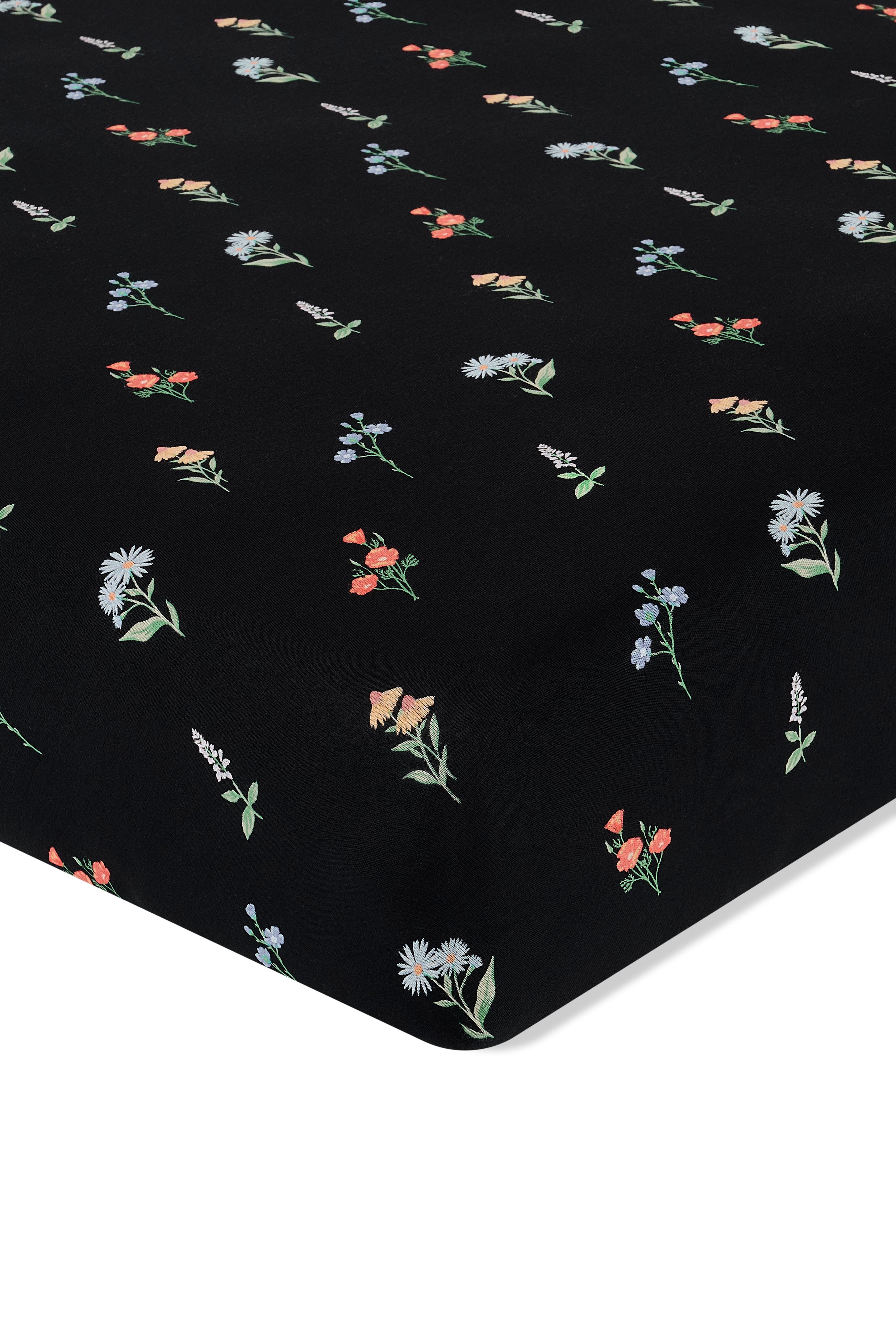 Black Crib Sheet in Wildflower print on a white background