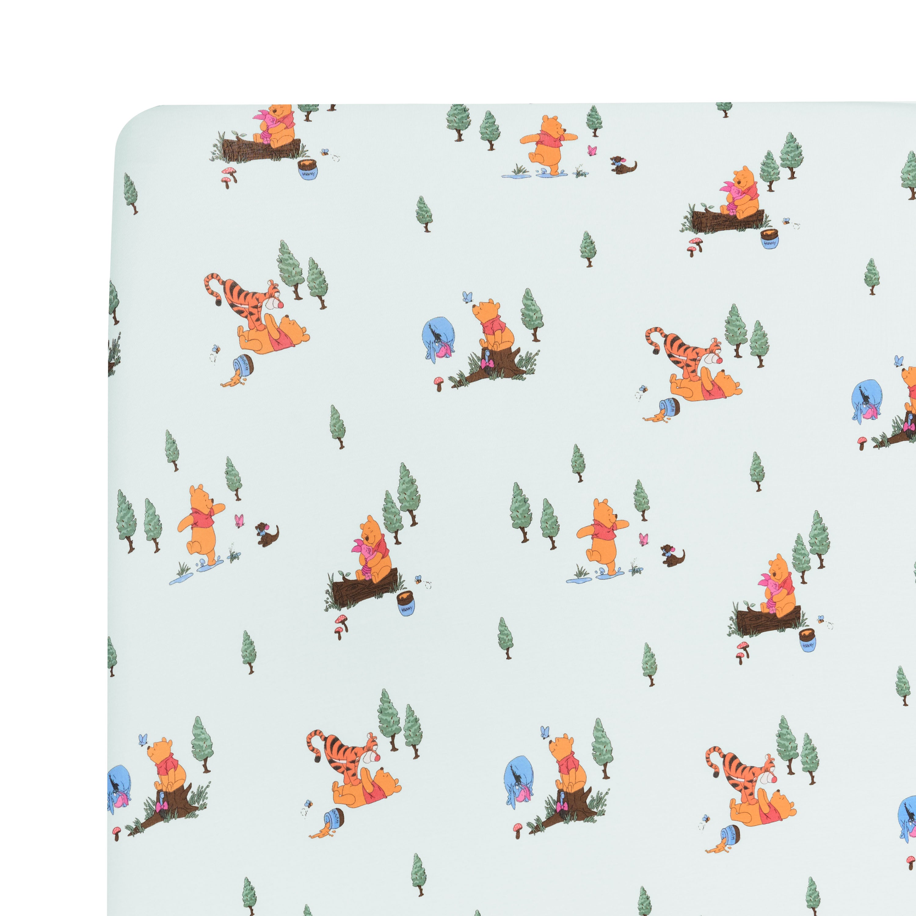 Close up of the Crib Sheet in Winnie the Pooh Hundred Acre Wood on a mattress