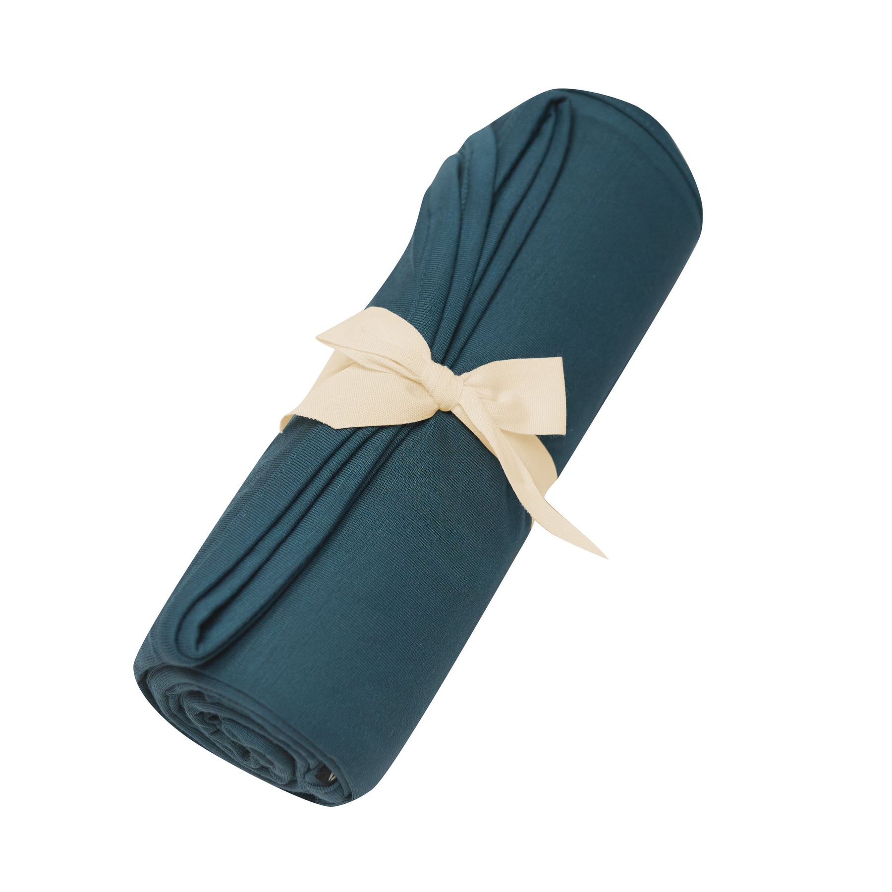 Swaddle Blanket in Atlantic shown rolled in its packaging