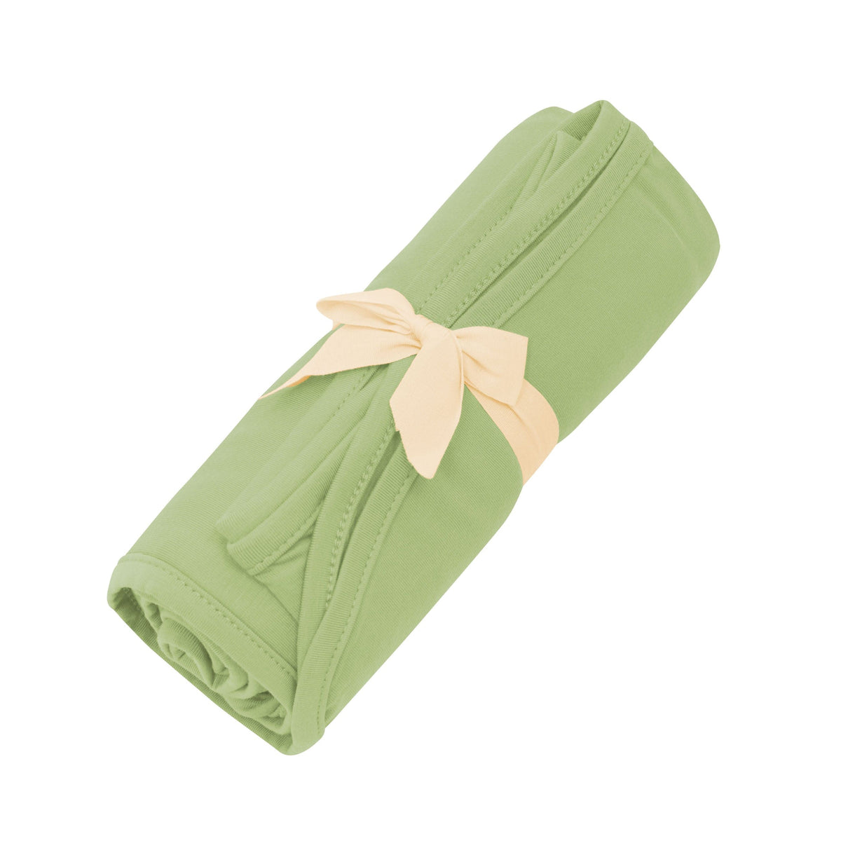 Kyte Baby Swaddle Blanket in Honu tied with bow