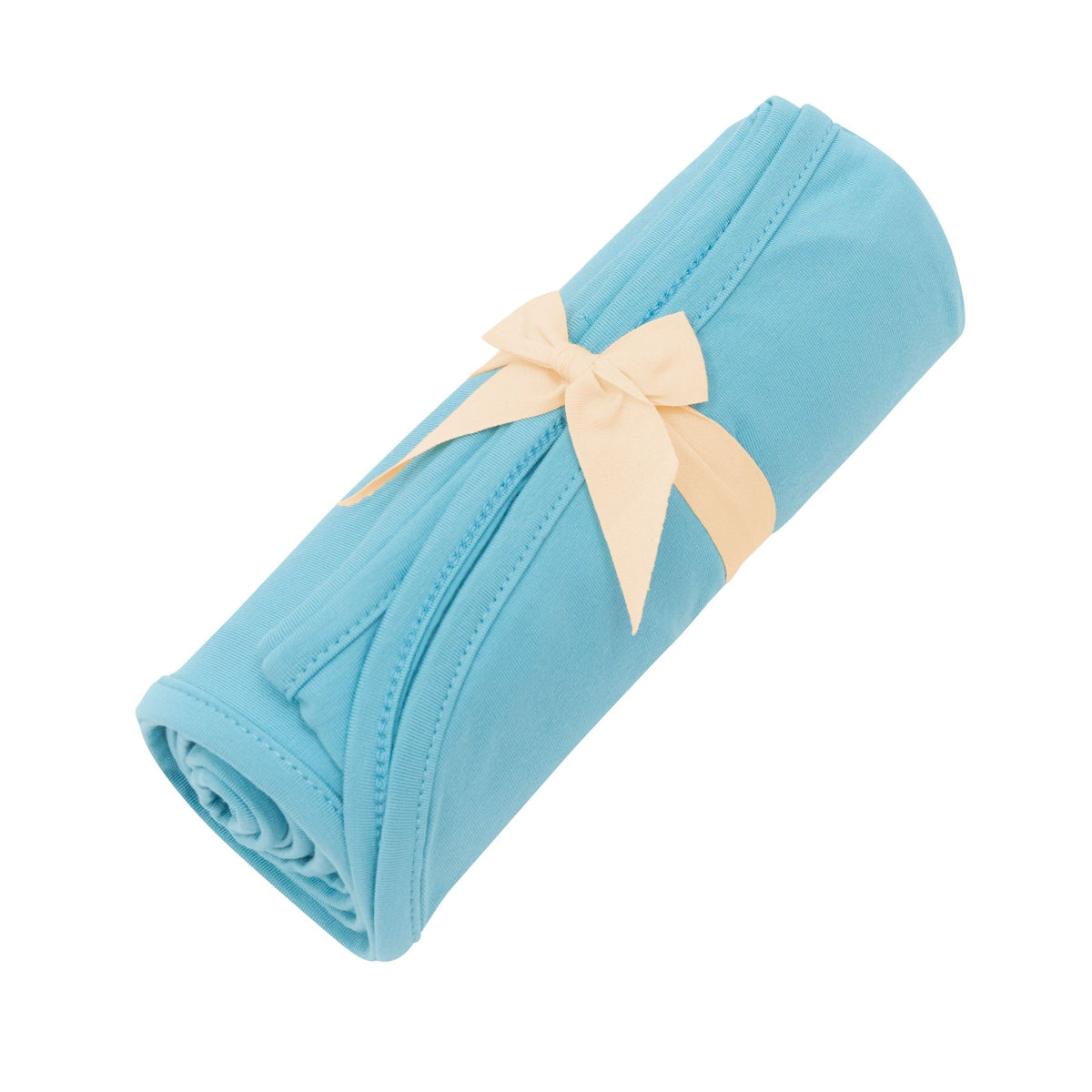 Kyte Baby Swaddle Blanket in Makai tied with bow