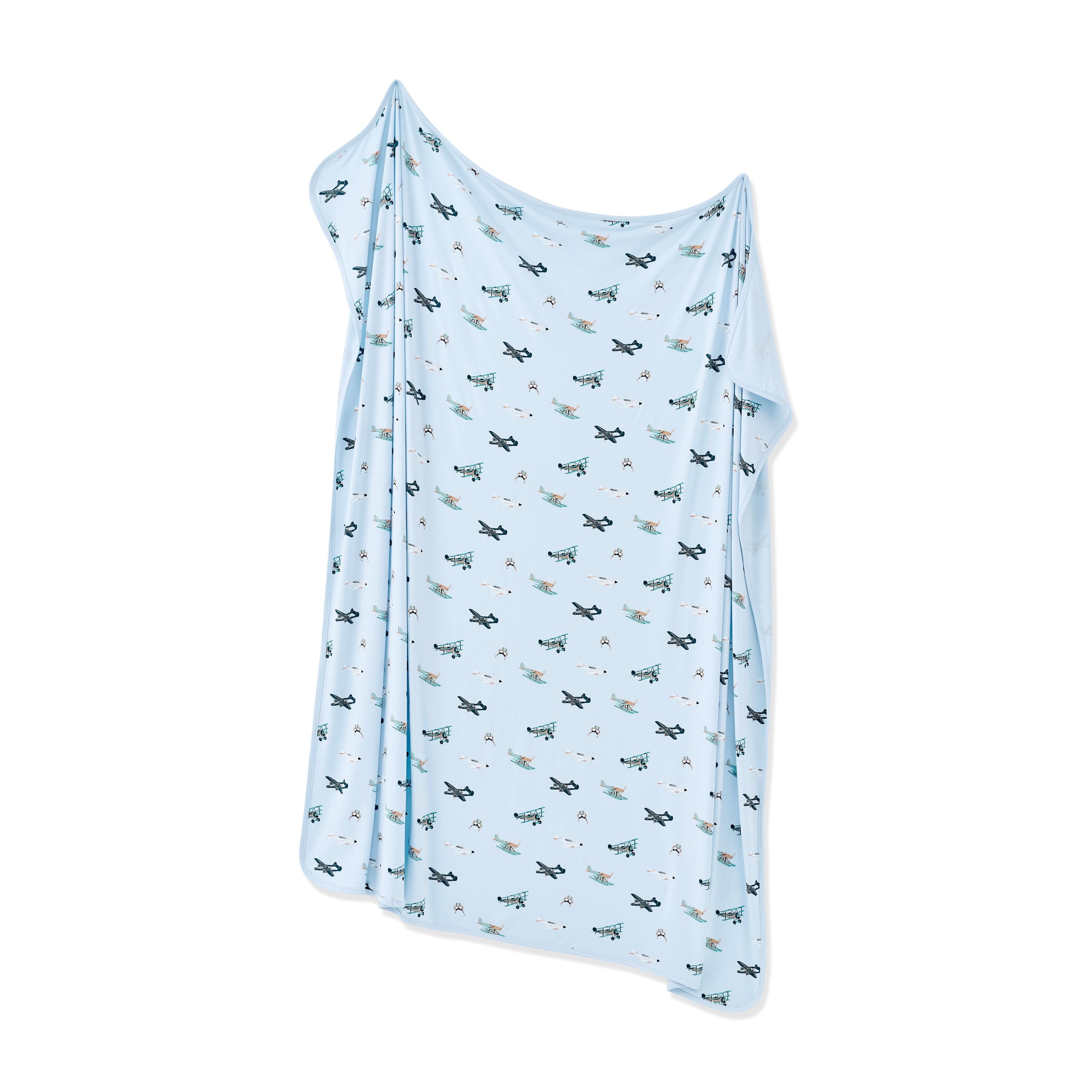 Swaddle Blanket in Take Off shown unswaddled