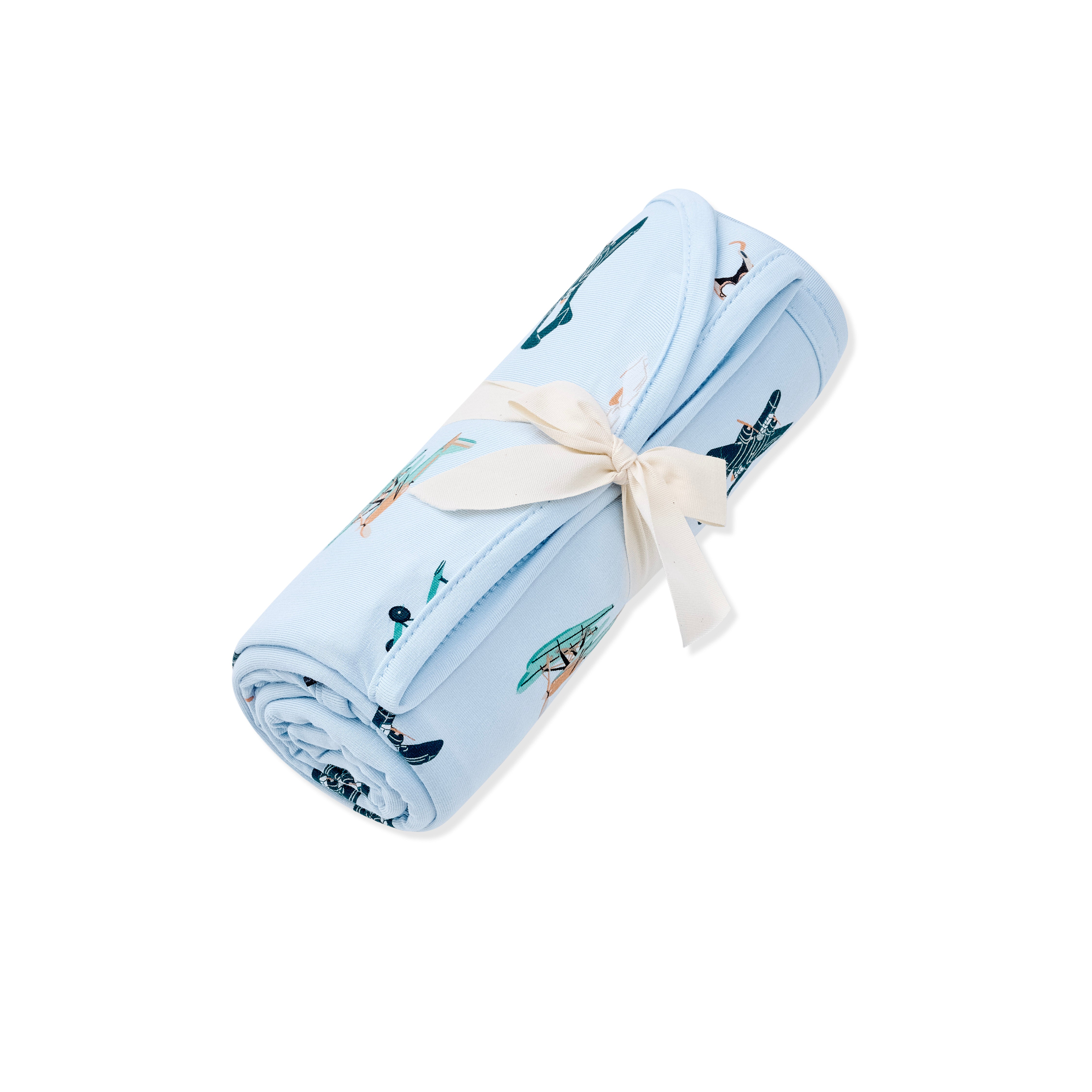 Swaddle Blanket in Take Off shown rolled in its packaging