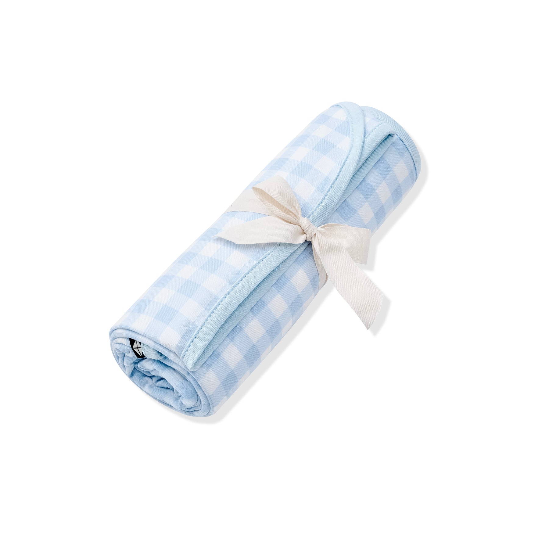 Swaddle Blanket in Gingham Breeze rolled in it packaging tied with a linen bow