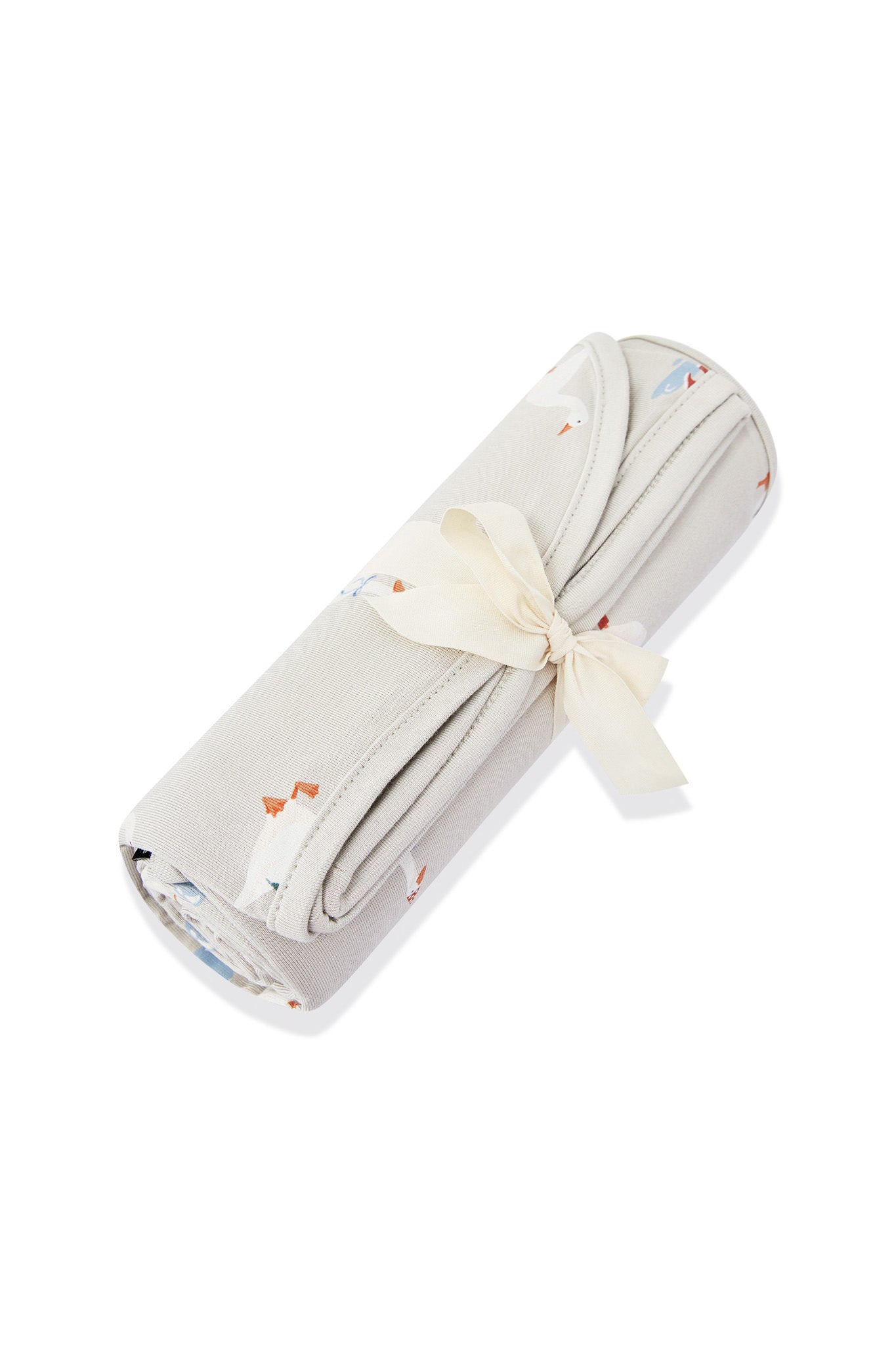 Swaddle Blanket in Oat Silly Goose print rolled in a ribbon on a white background