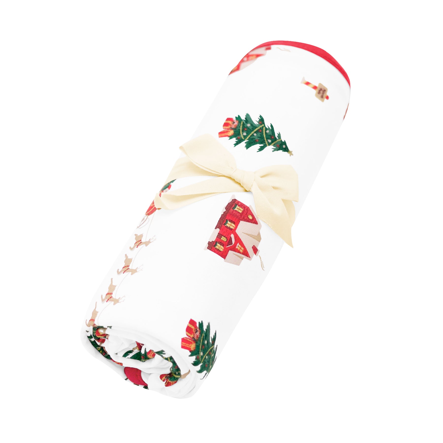 Swaddle Blanket in Santa Sleigh shown rolled in its packaging tied with a linen bow