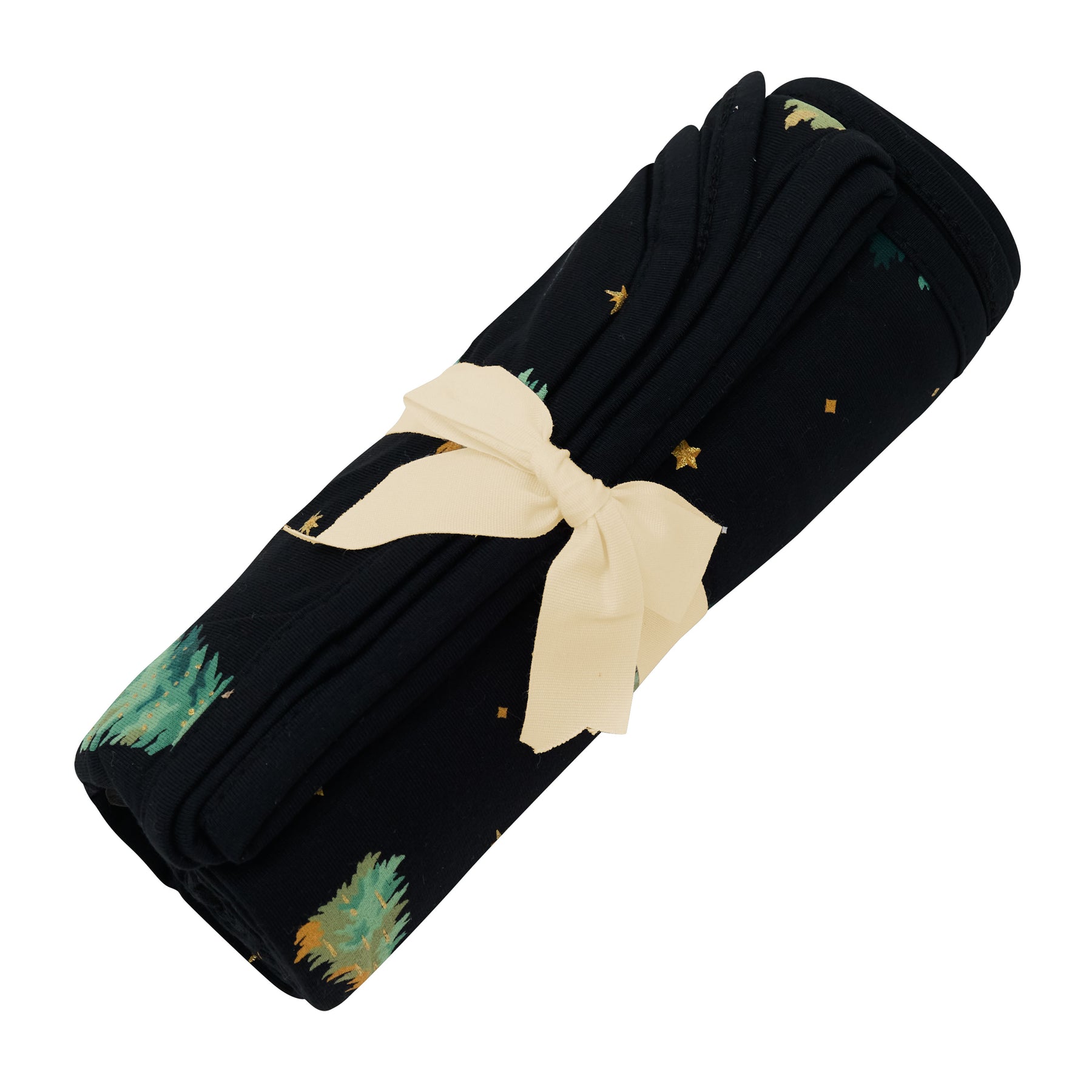 Swaddle Blanket in Twinkle Tree shown rolled in its packaging tied with a linen bow