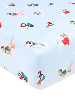 Blue Twin Sheet in Holiday Pups print on a white background